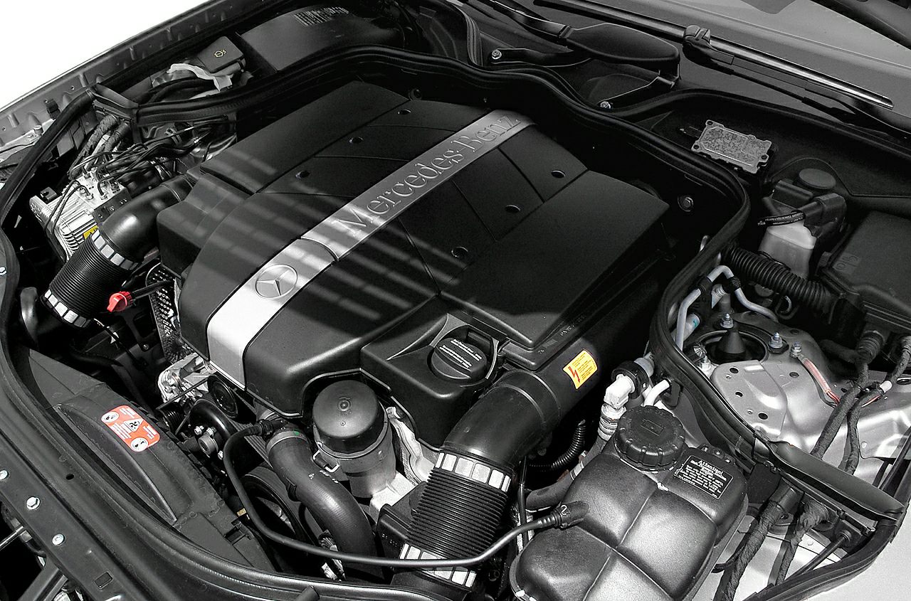 Mercedes-Benz branded engine bay with visible components and engine cover