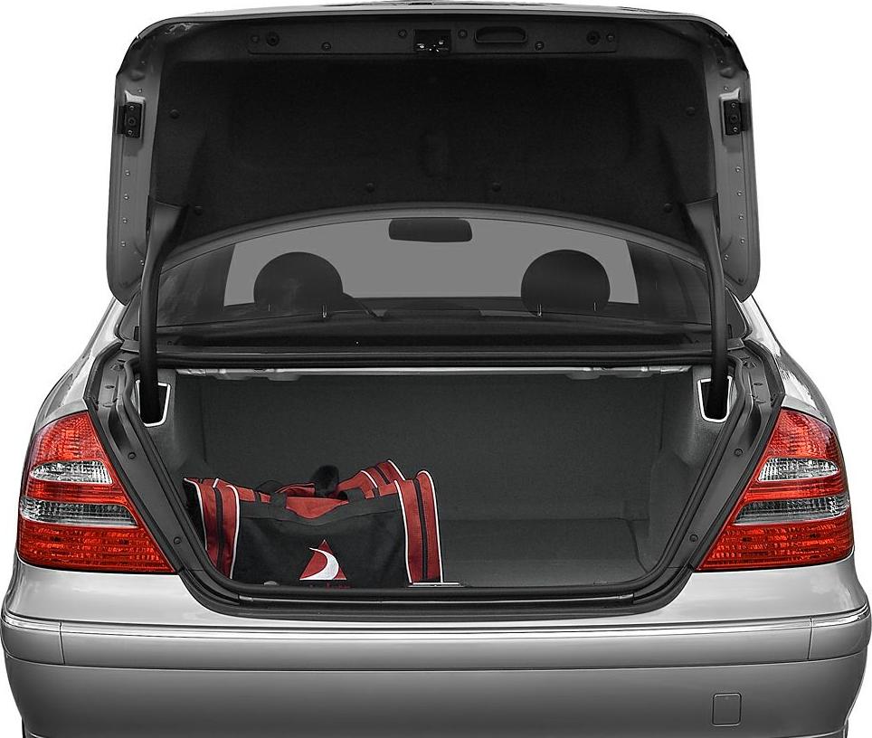 Open rear trunk with visible storage space and a single sports bag.