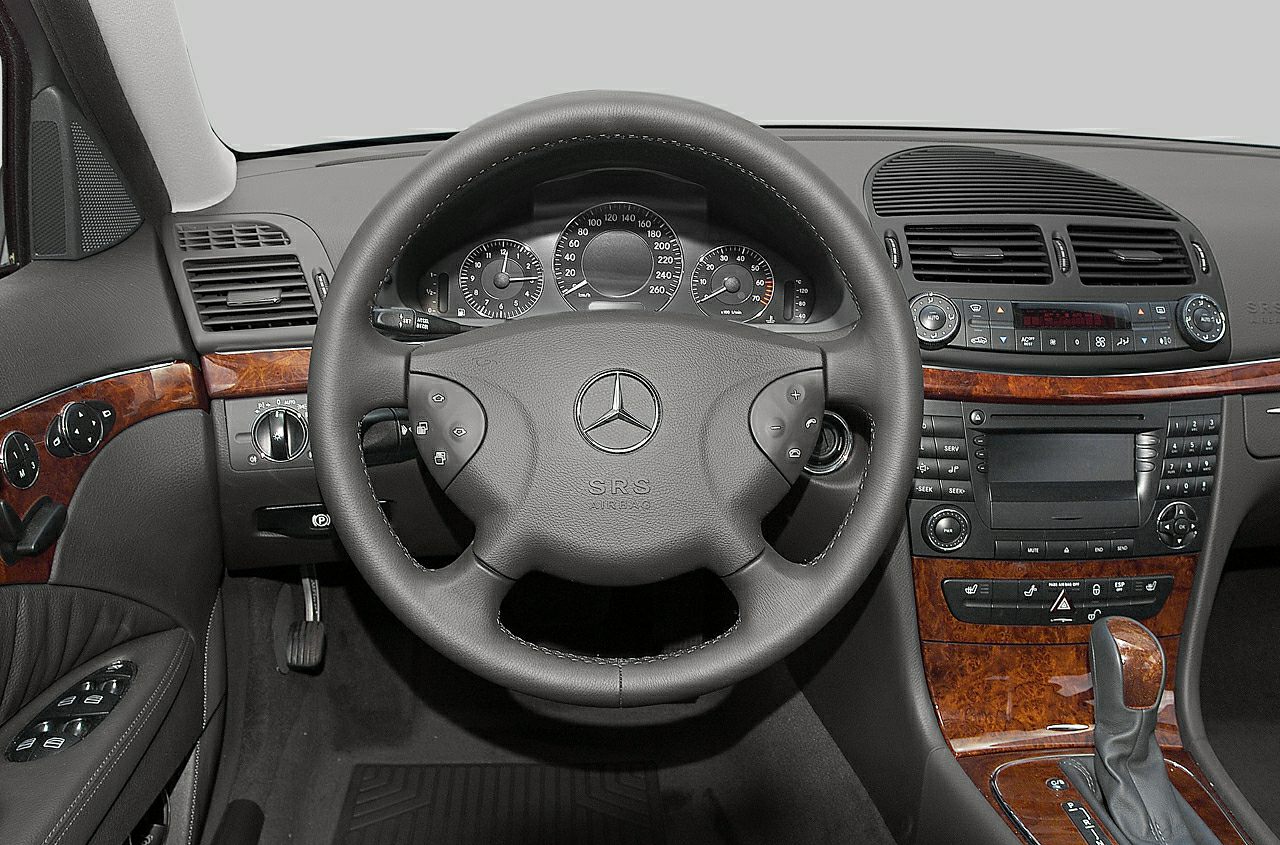 Dashboard with steering wheel and wood trim accents