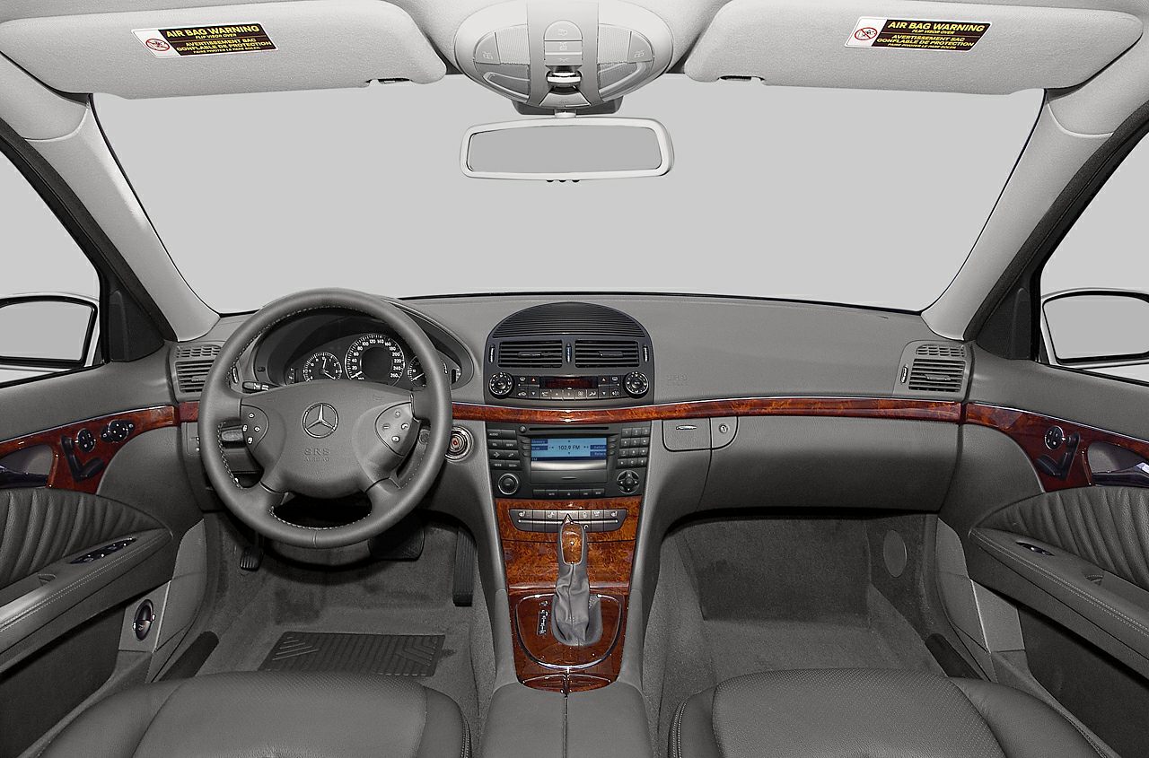 Dashboard with steering wheel and wooden trim detailing