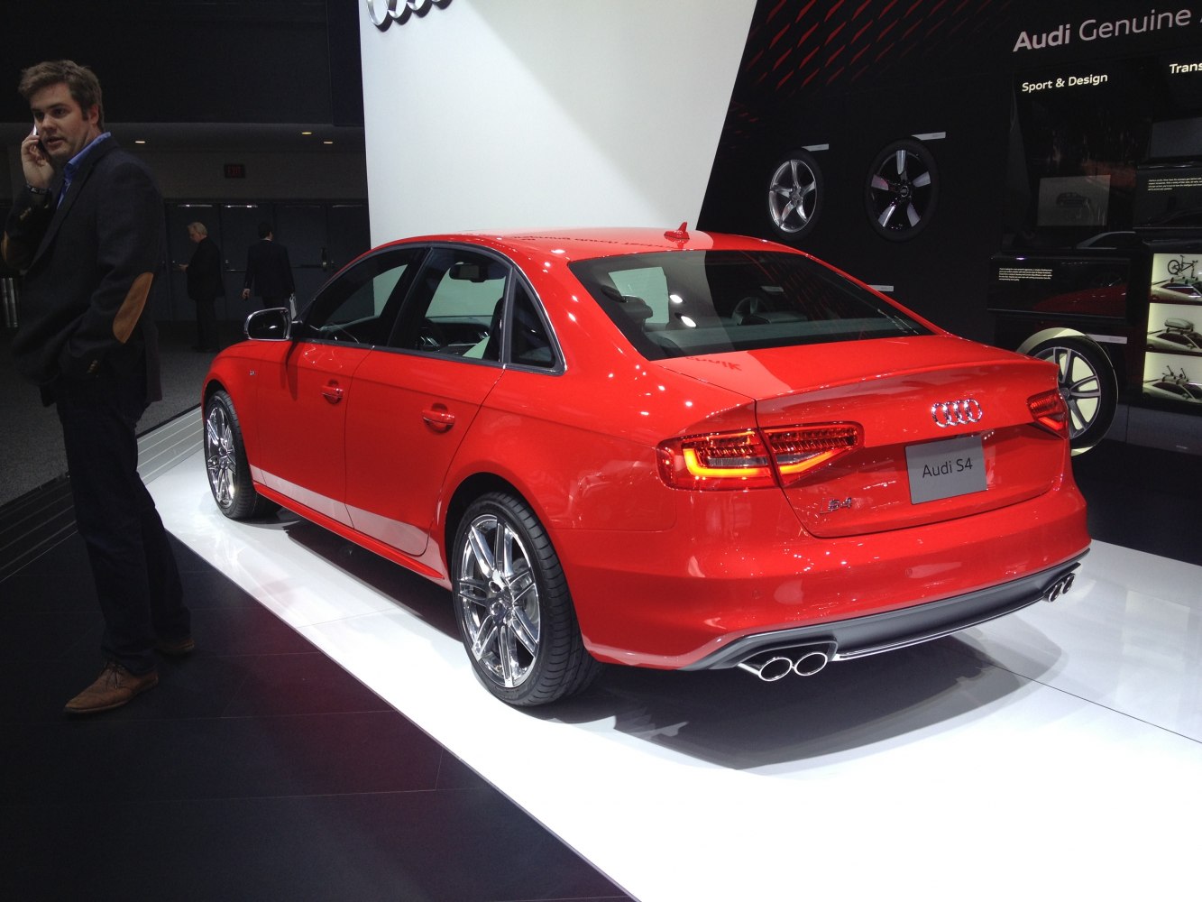 Rear view with quad exhaust pipes and sporty alloy wheels
