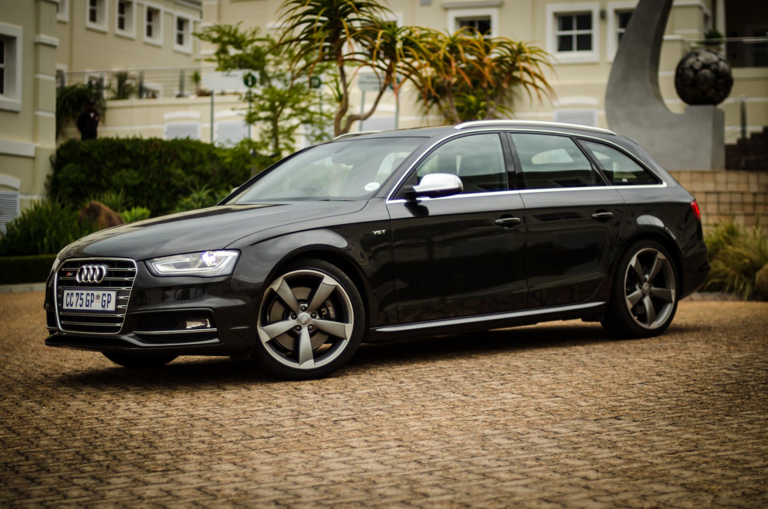 Black station wagon with alloy wheels and chrome mirrors
