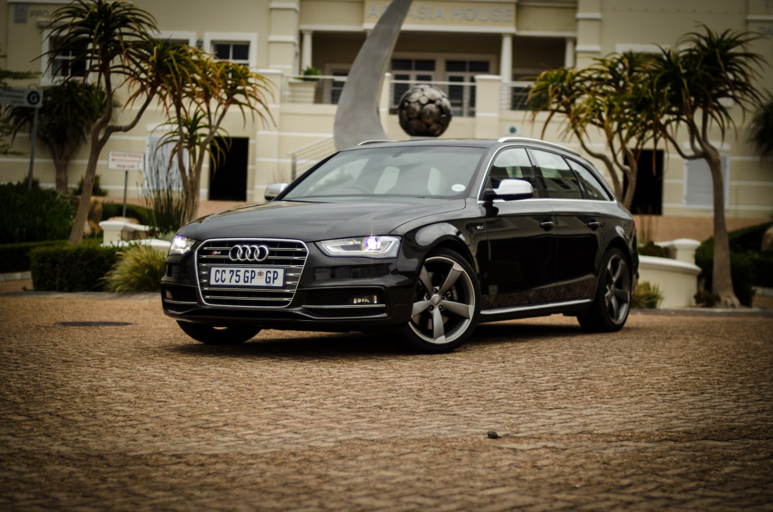 Front and side view of black luxury station wagon with LED headlights and sporty alloy wheels.
