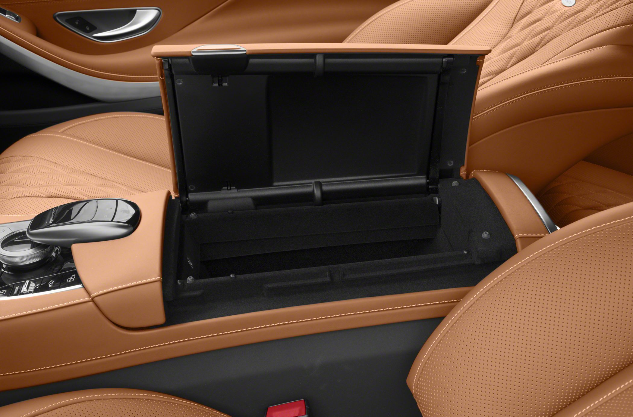 Open center console with brown perforated leather seats
