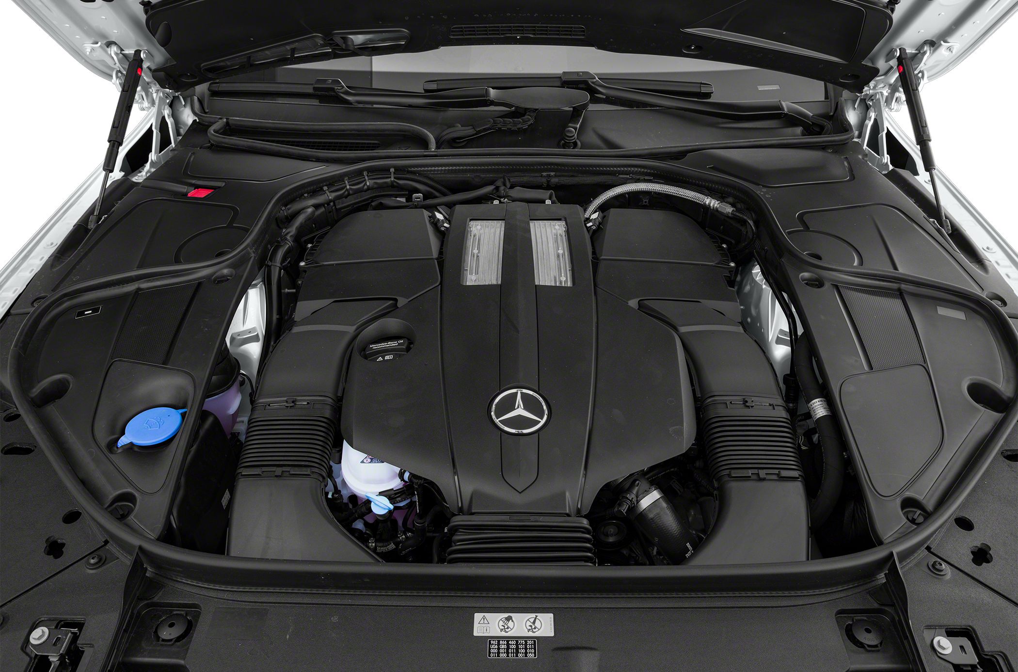 Luxury car engine bay with detailed engine cover and components