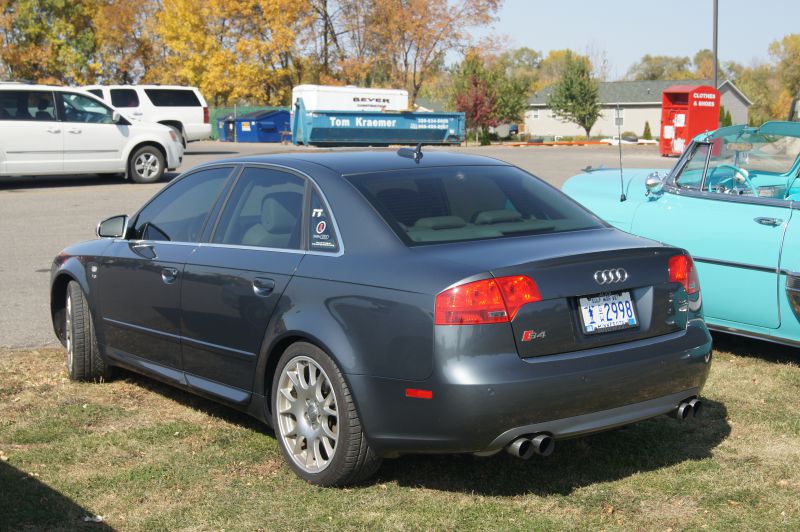 Rear view of a sport sedan with distinctive dual exhaust and taillights