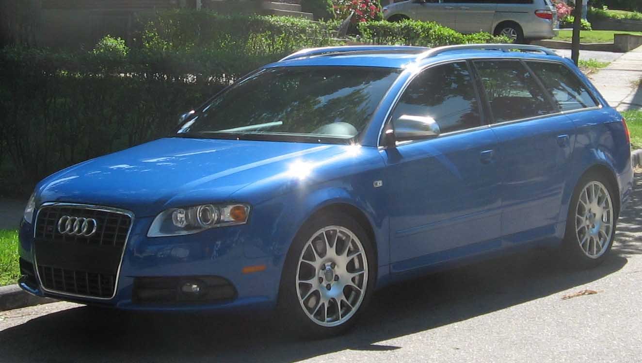 Blue sporty station wagon with alloy wheels and roof rails