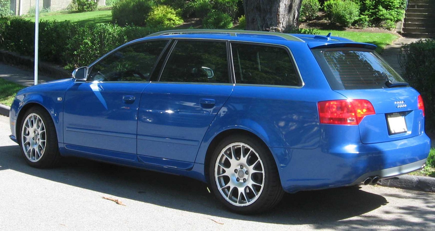 Blue wagon with side and rear view, alloy wheels, dual exhaust