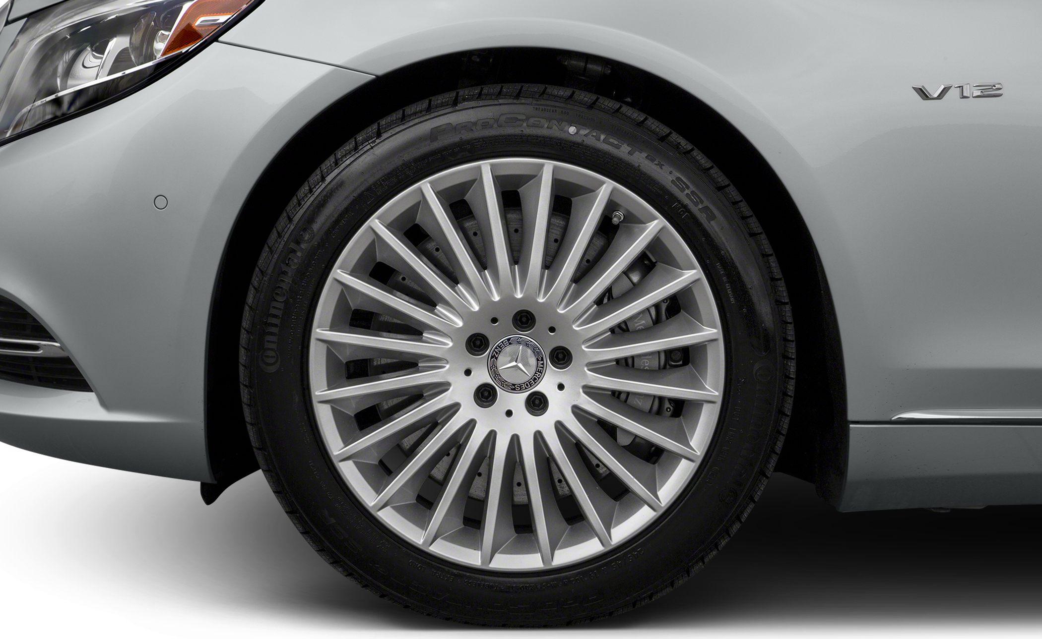 Luxury multi-spoke alloy wheel and V12 engine emblem on front fender