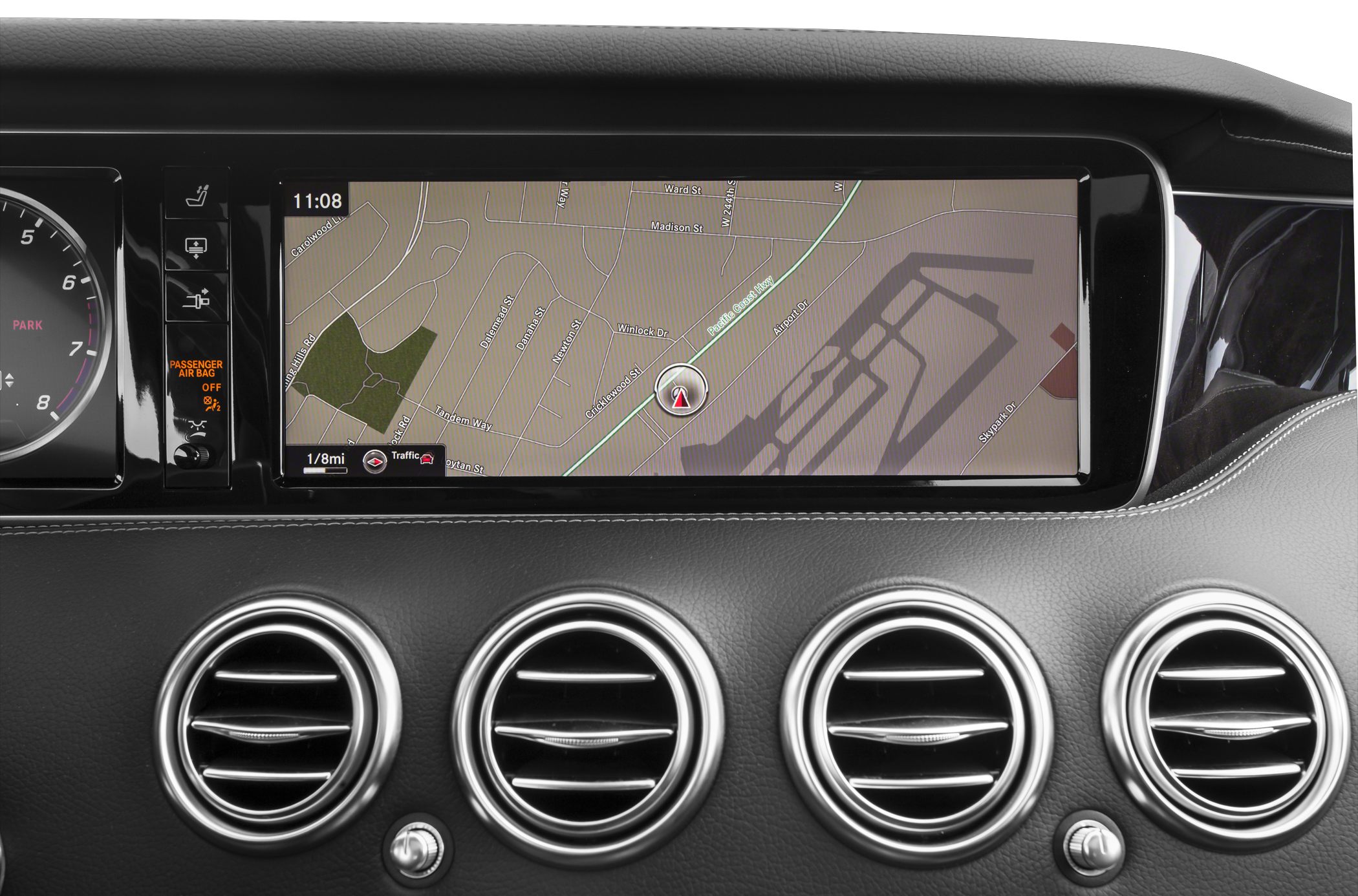 Wide navigation display and four circular air vents on dashboard