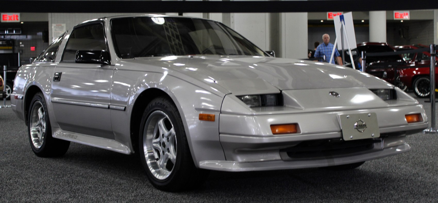 Sporty coupe with pop-up headlights and alloy wheels