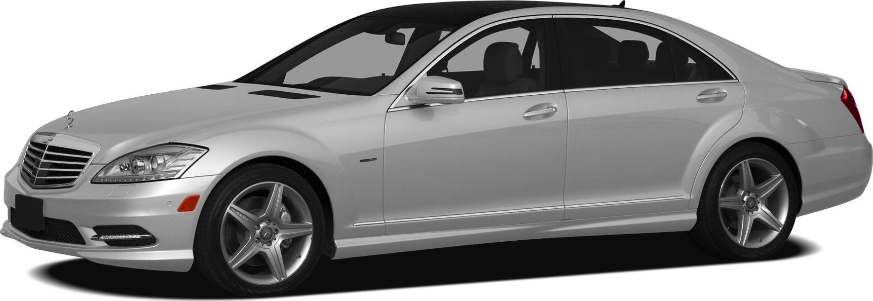 Silver mid-size luxury sedan with AMG wheels and LED daytime running lights