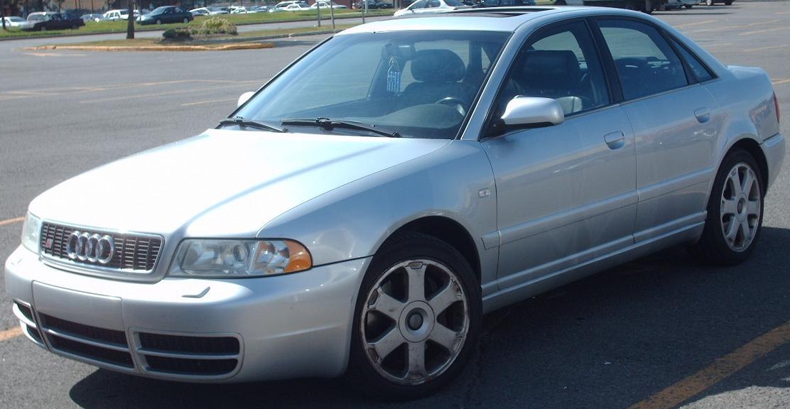 Silver sedan with distinct alloy wheels and front headlight design