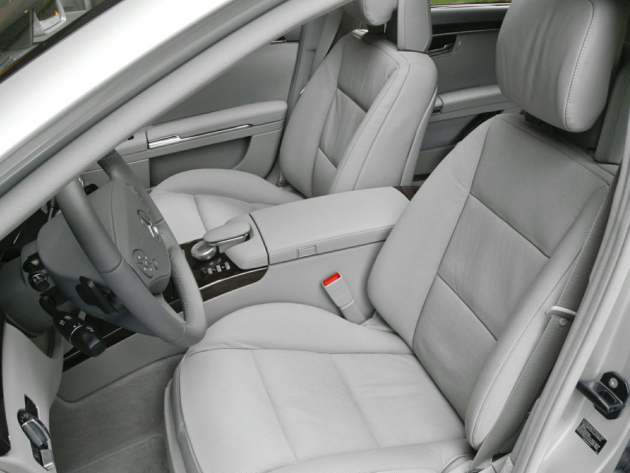 Front seats and center console with luxury leather upholstery and steering wheel