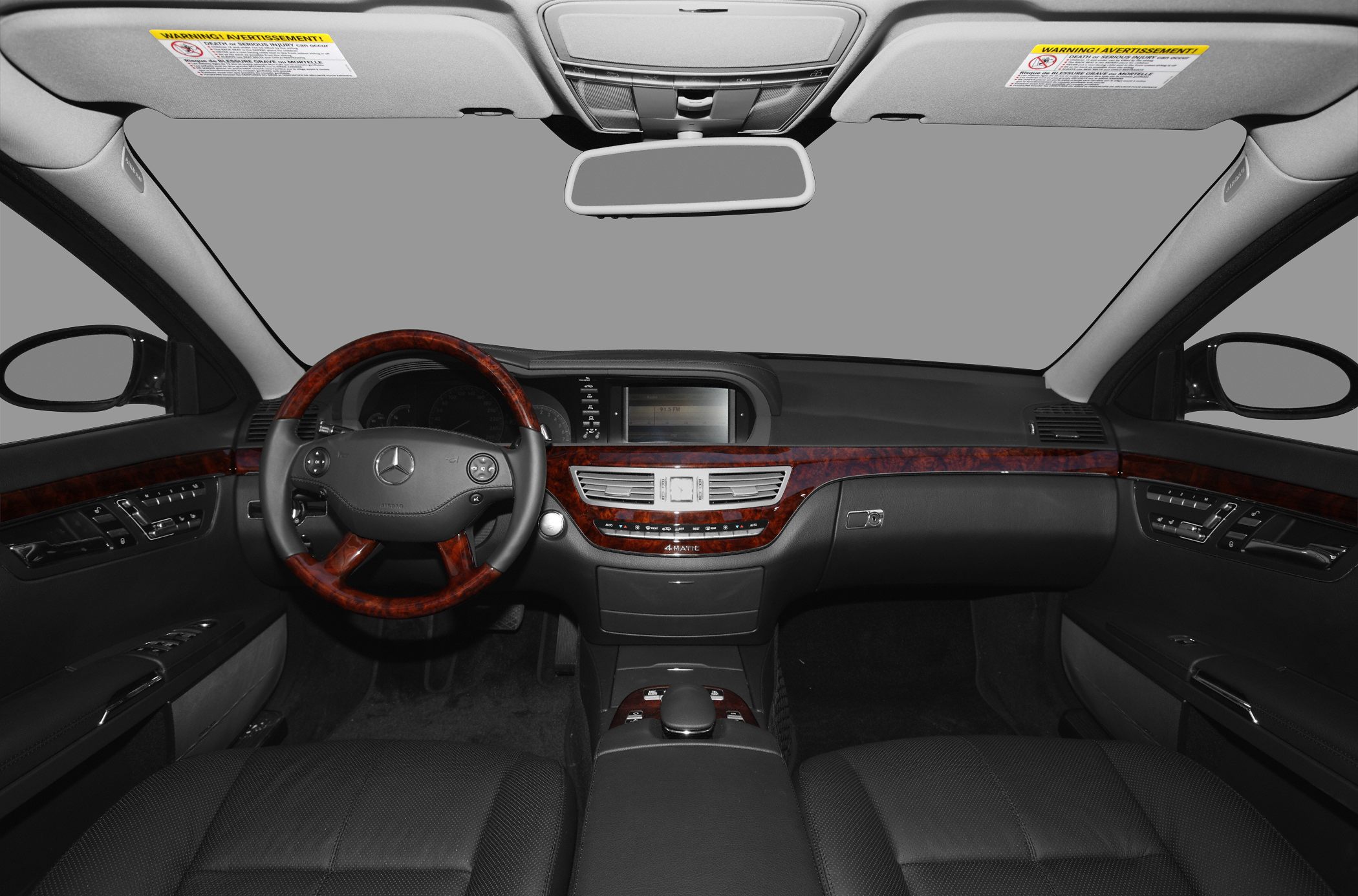 Luxury wood trim dashboard and steering wheel with integrated controls