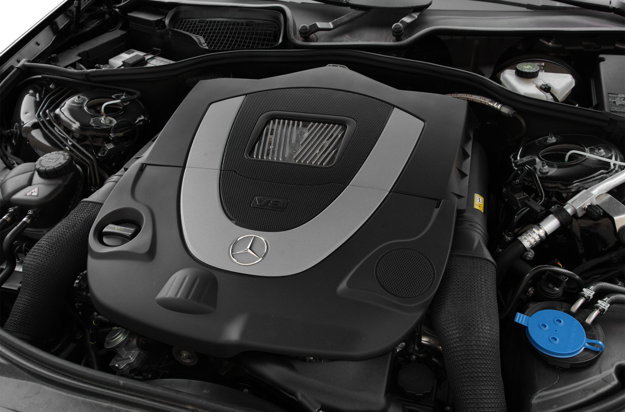 V8 engine cover with branded emblem and detailed components
