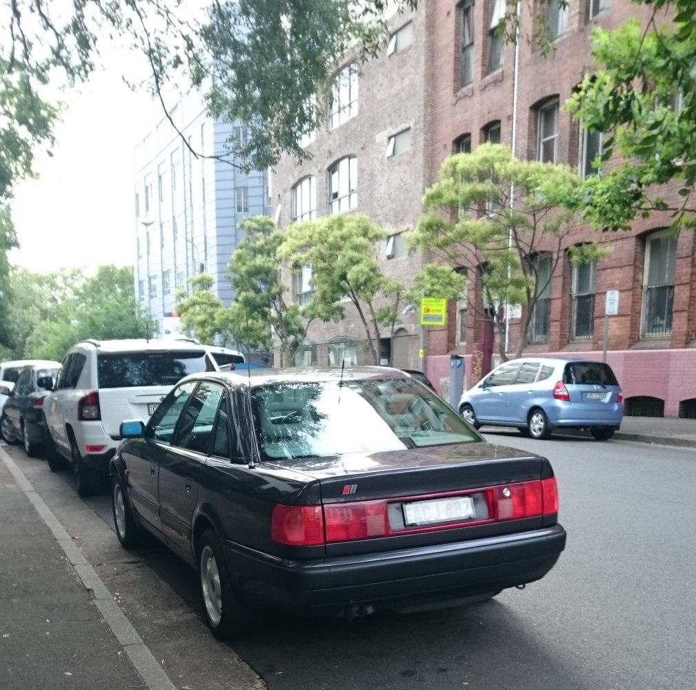 Rear view of classic sedan with distinctive horizontal taillights