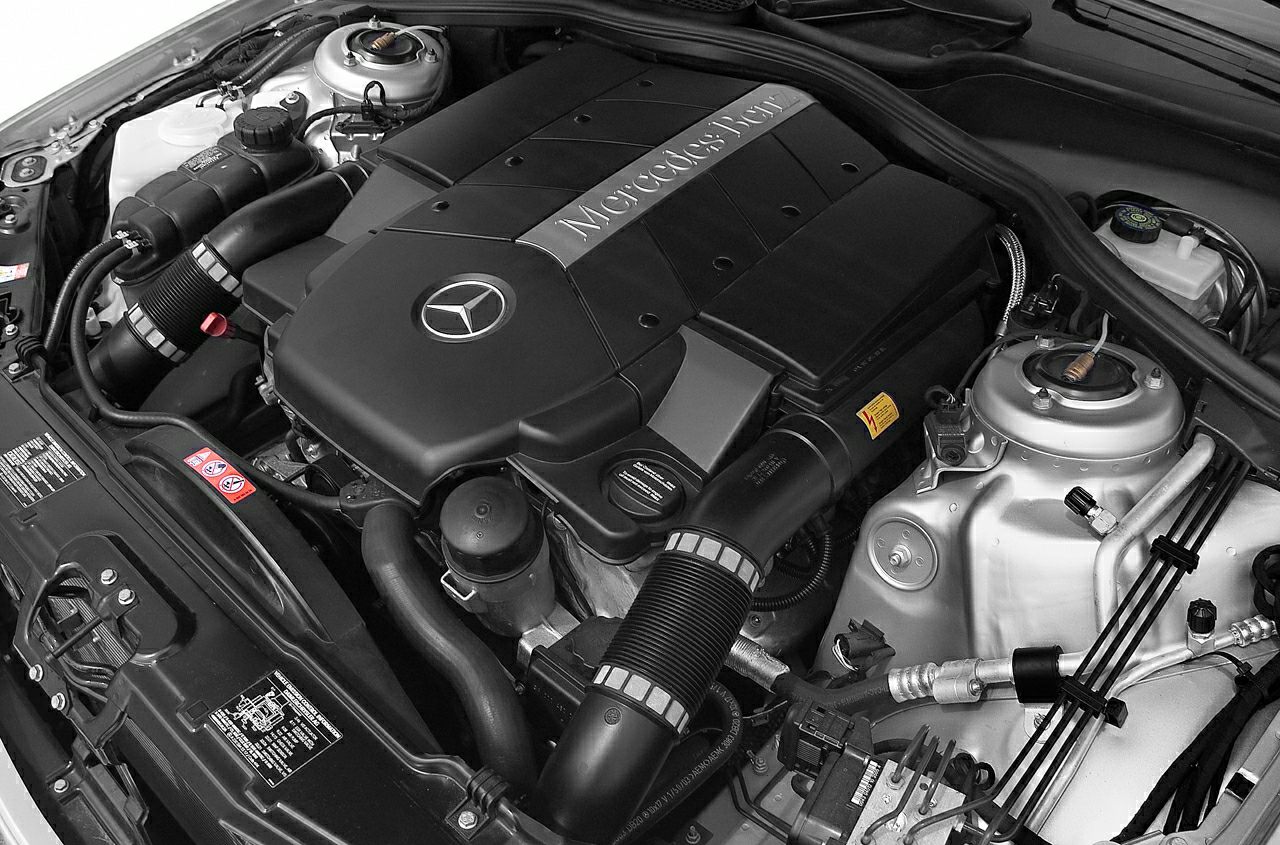 Engine bay close-up with covered Mercedes-Benz engine and components