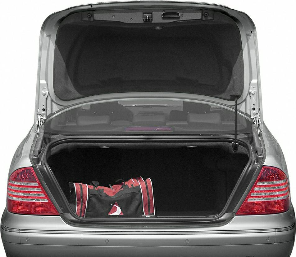 Open trunk with red and black sports bag, rear tail lights visible
