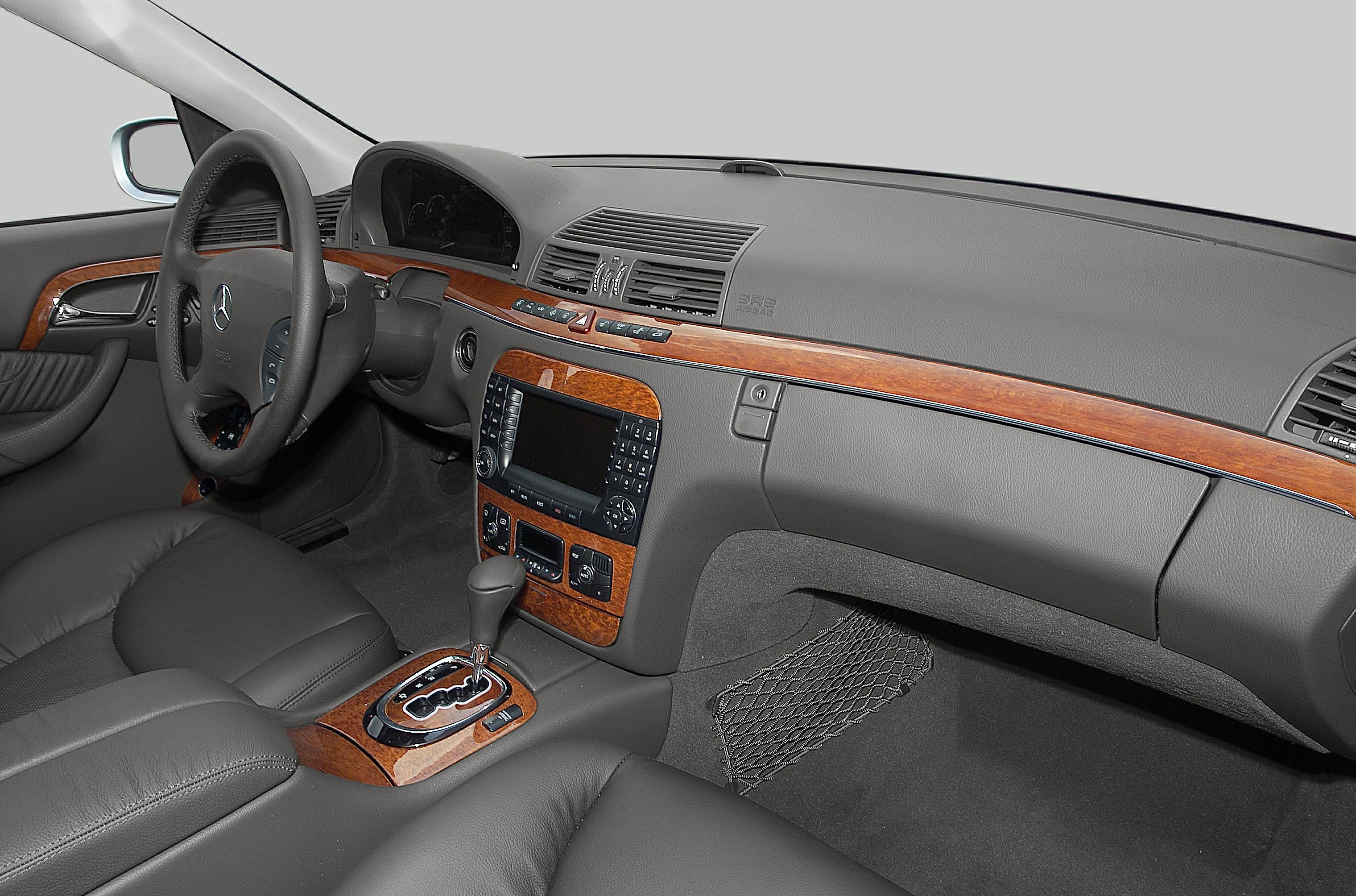 Wood trim dashboard and automatic gear selector in black leather interior