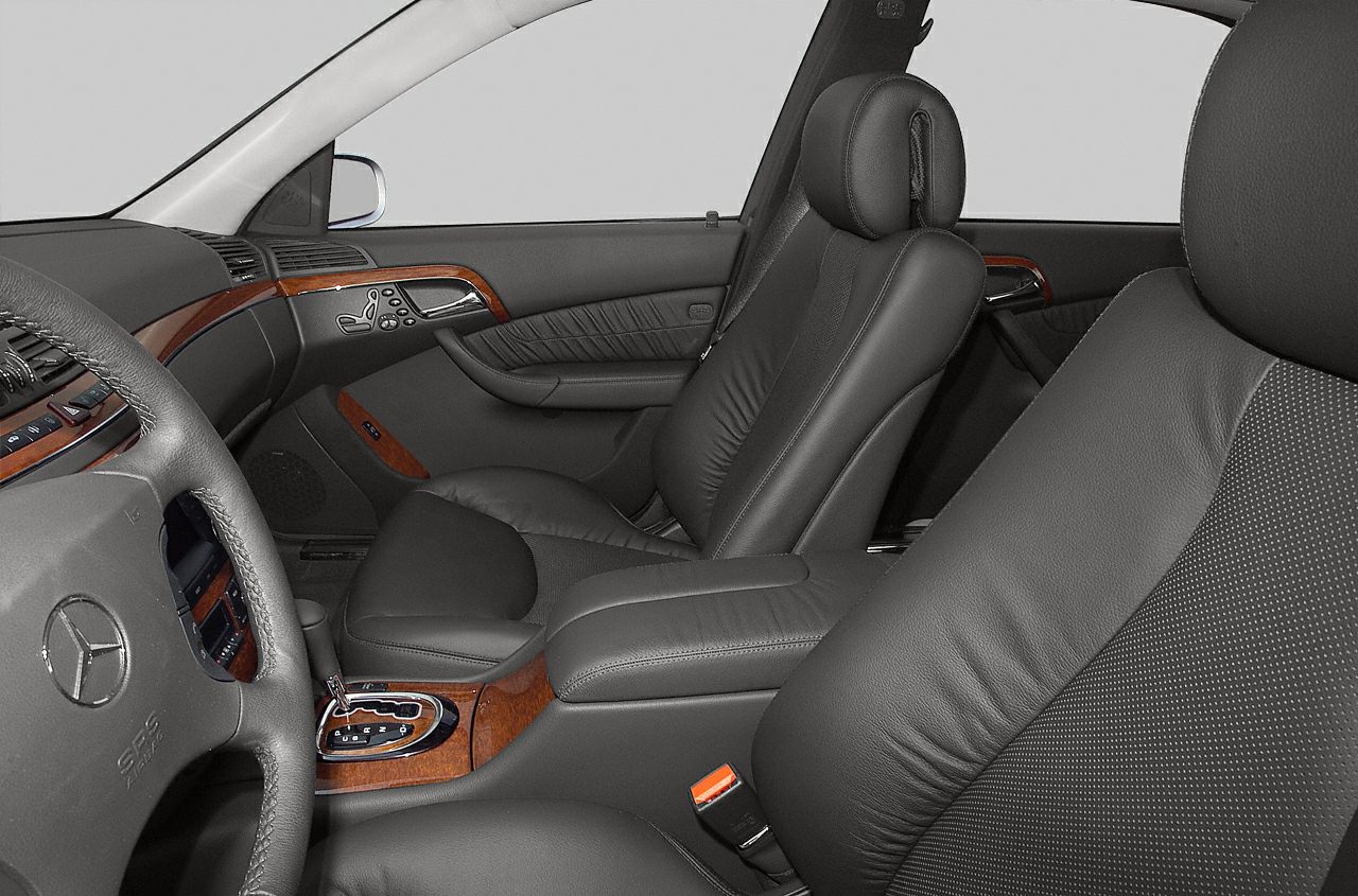 Luxury leather seats with detailed wood trim inside a car interior