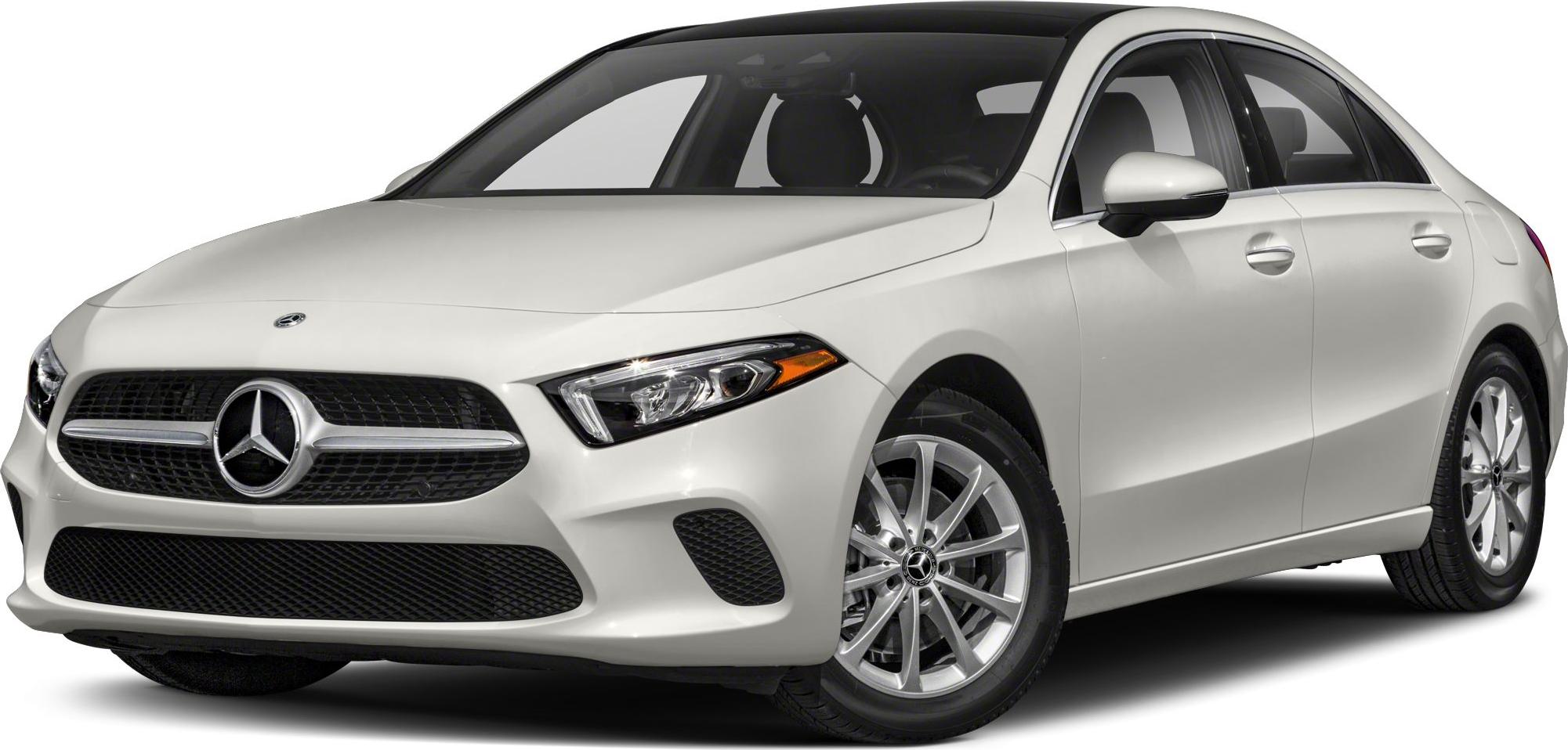Front three-quarter view of a white sedan with distinctive grille and headlights