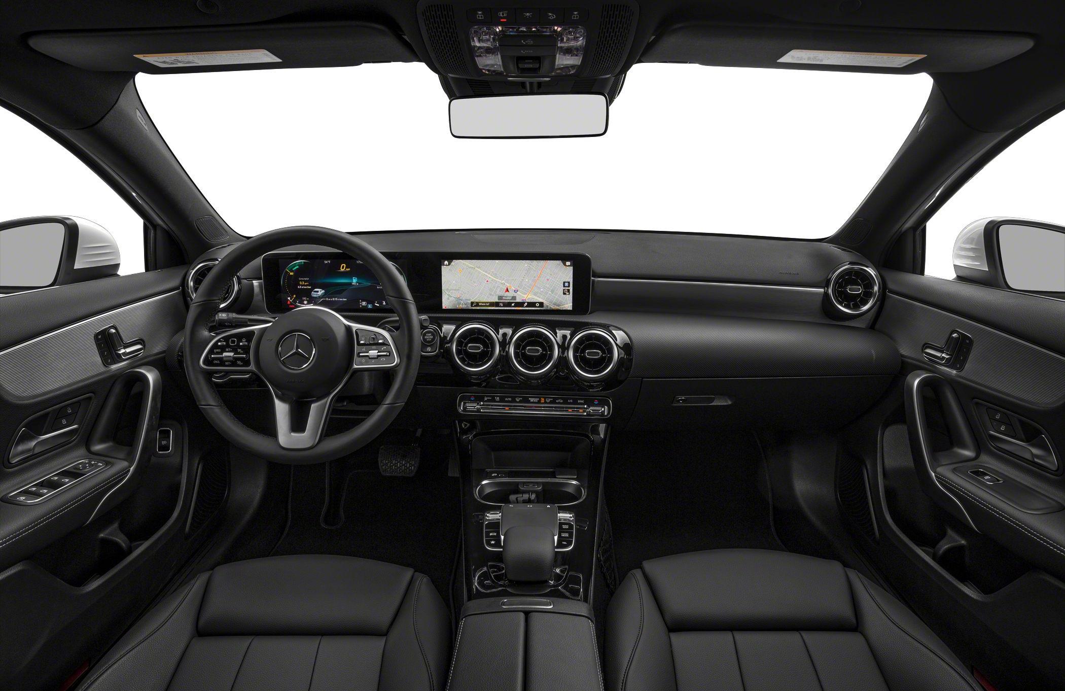 Digital instrument cluster and touchscreen infotainment with three circular air vents