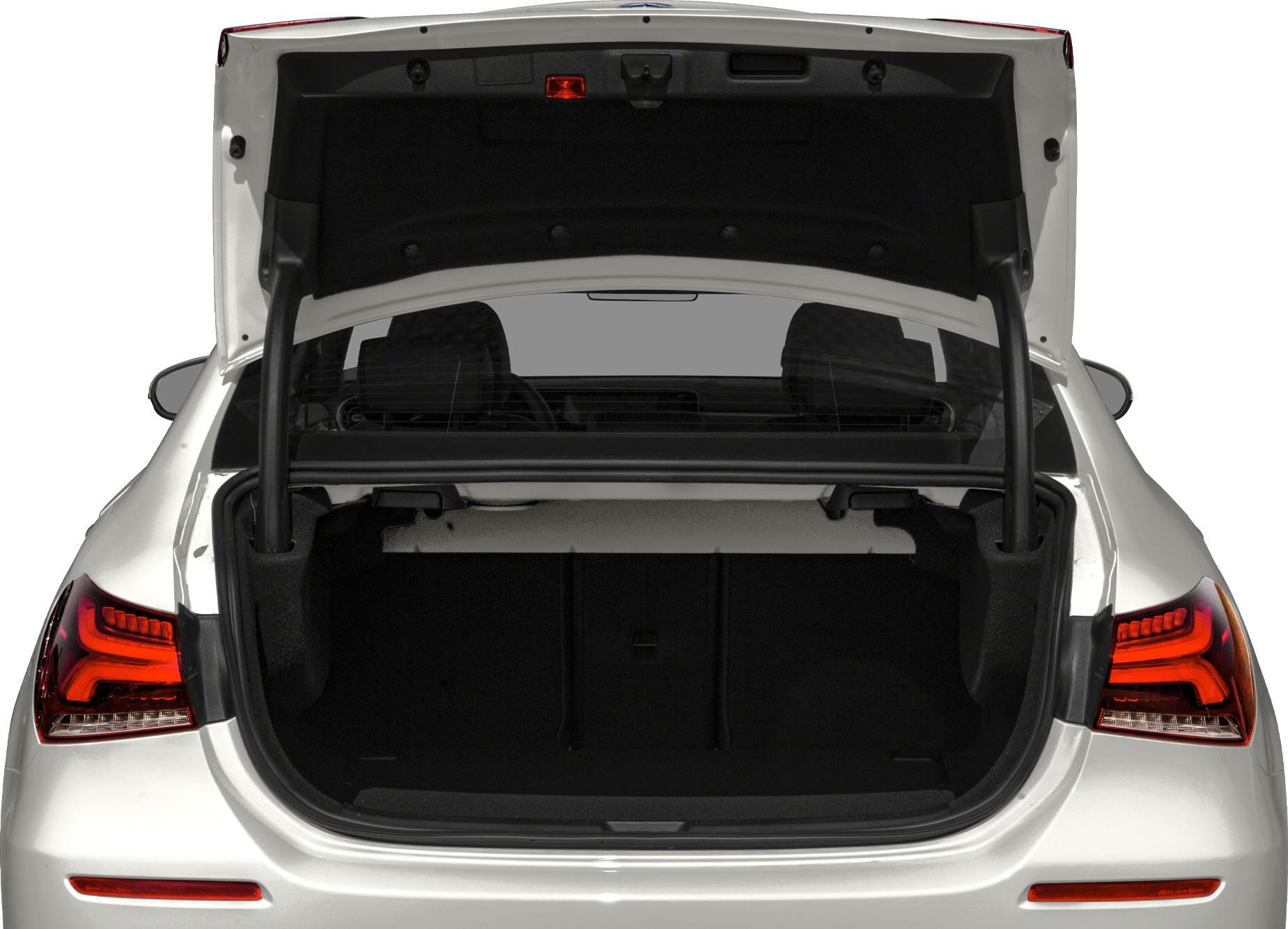 Open trunk view of a modern sedan with illuminated tail lights