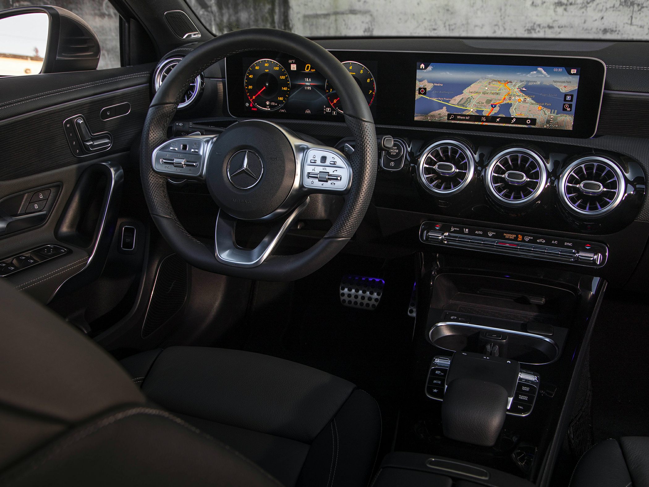Digital dashboard with navigation screen and modern luxury interior