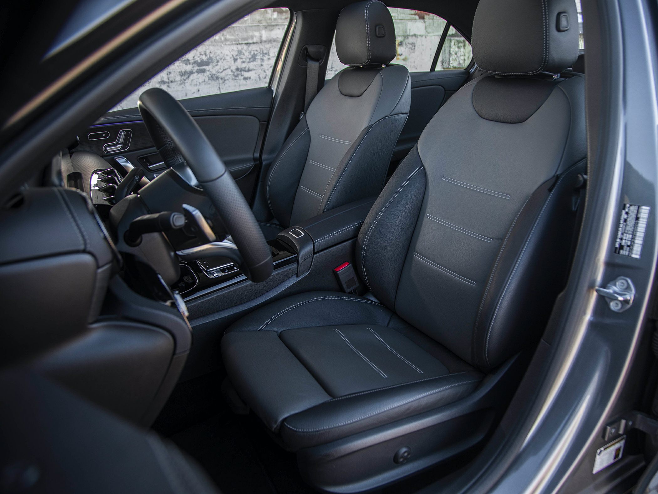 Front leather seats and steering wheel with modern controls