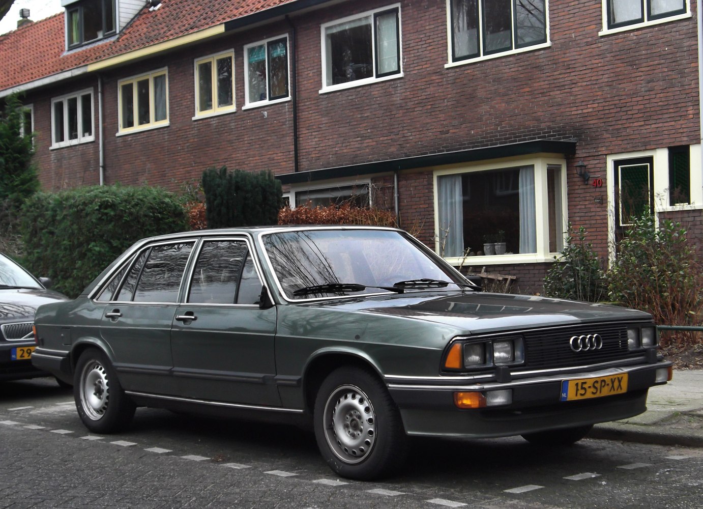 Front-left side view of classic four-door sedan with vintage 1980s styling