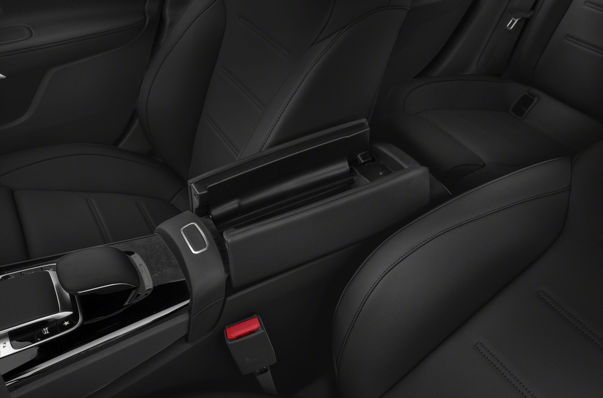 Black leather seats and center console with open armrest compartment