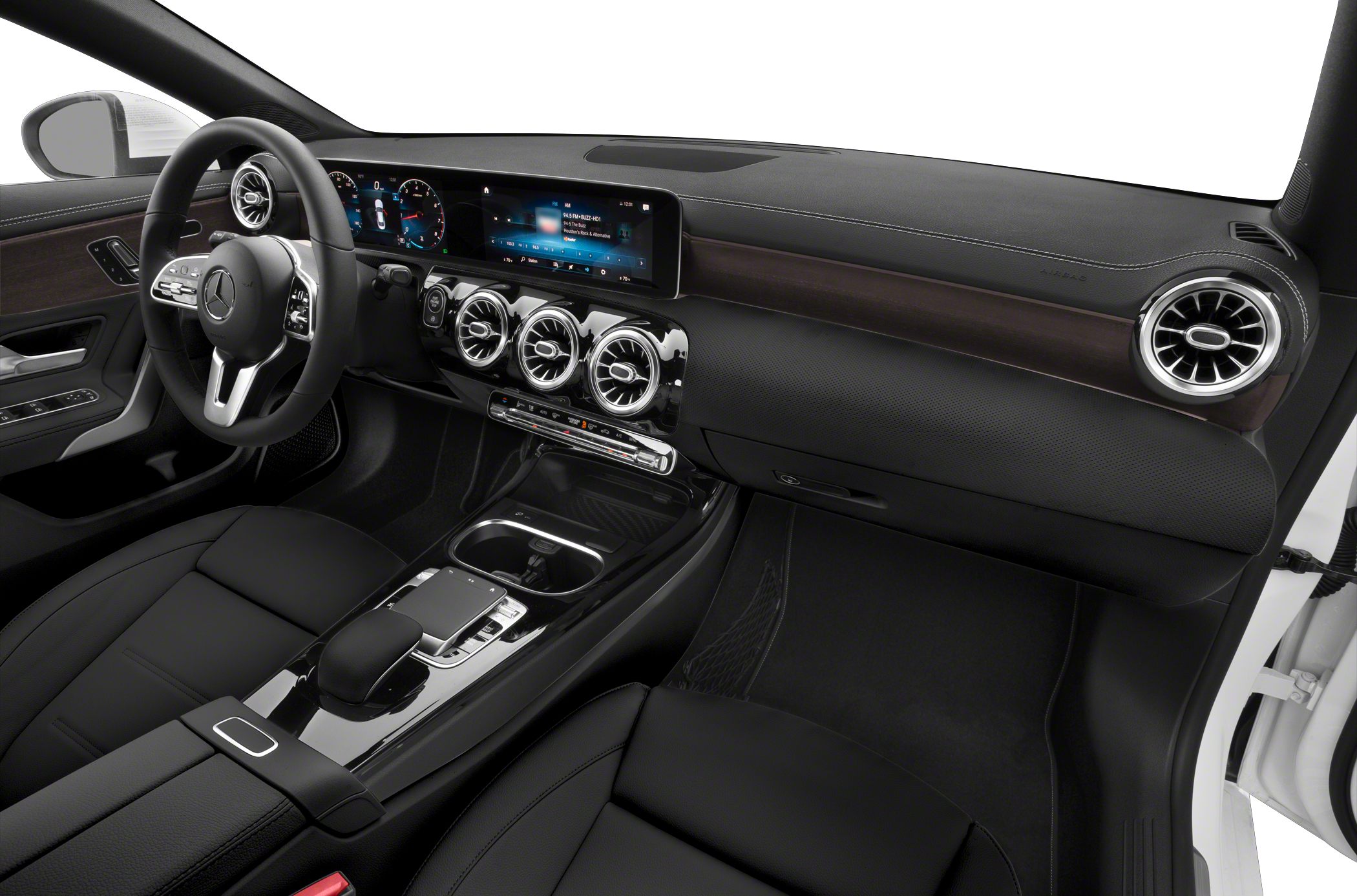 Luxury car interior with digital dashboard and circular air vents.