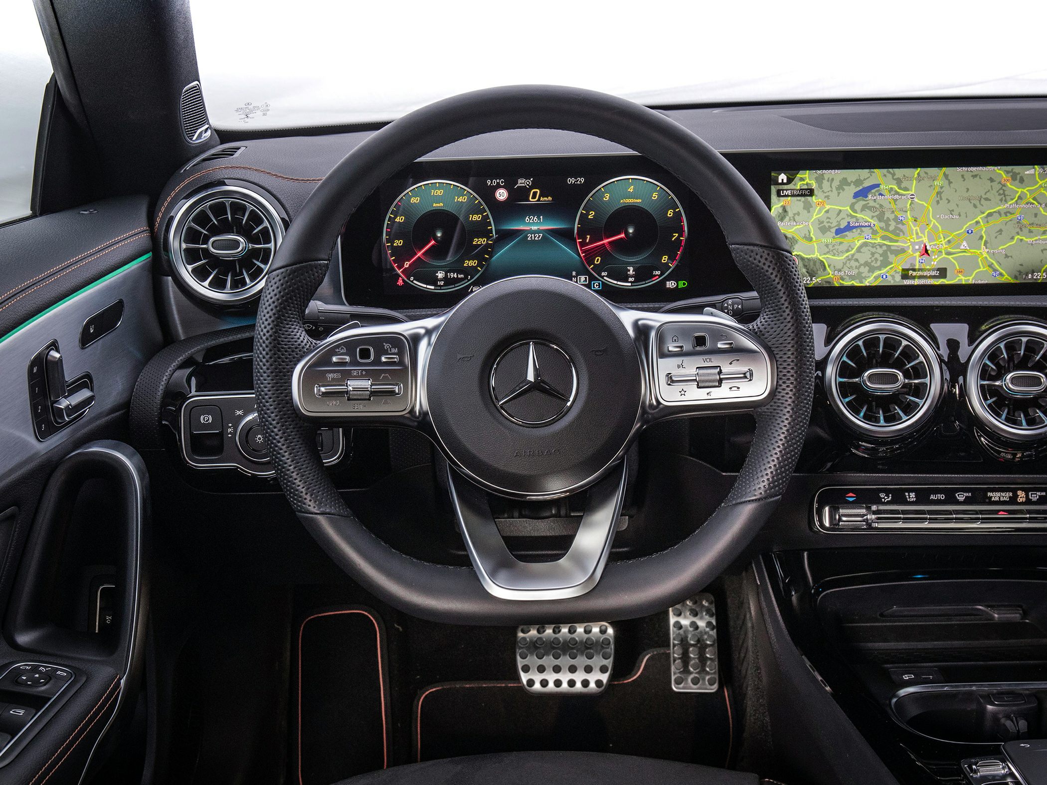 Digital dash and steering wheel with air vents and infotainment screen