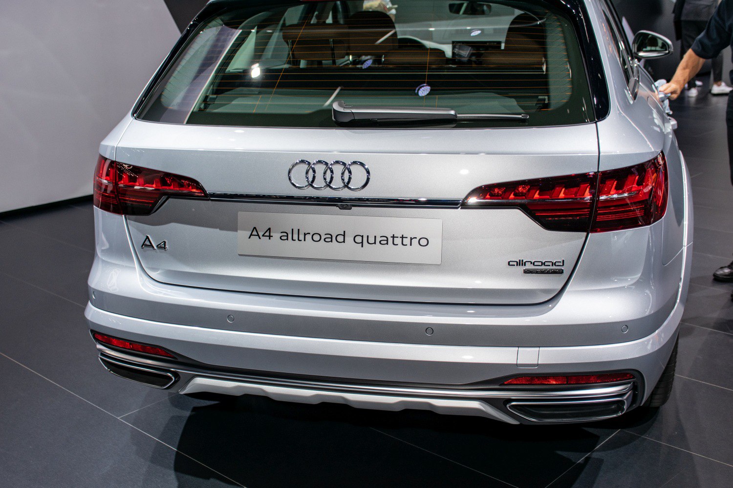Rear view of silver car with taillights and Quattro badge