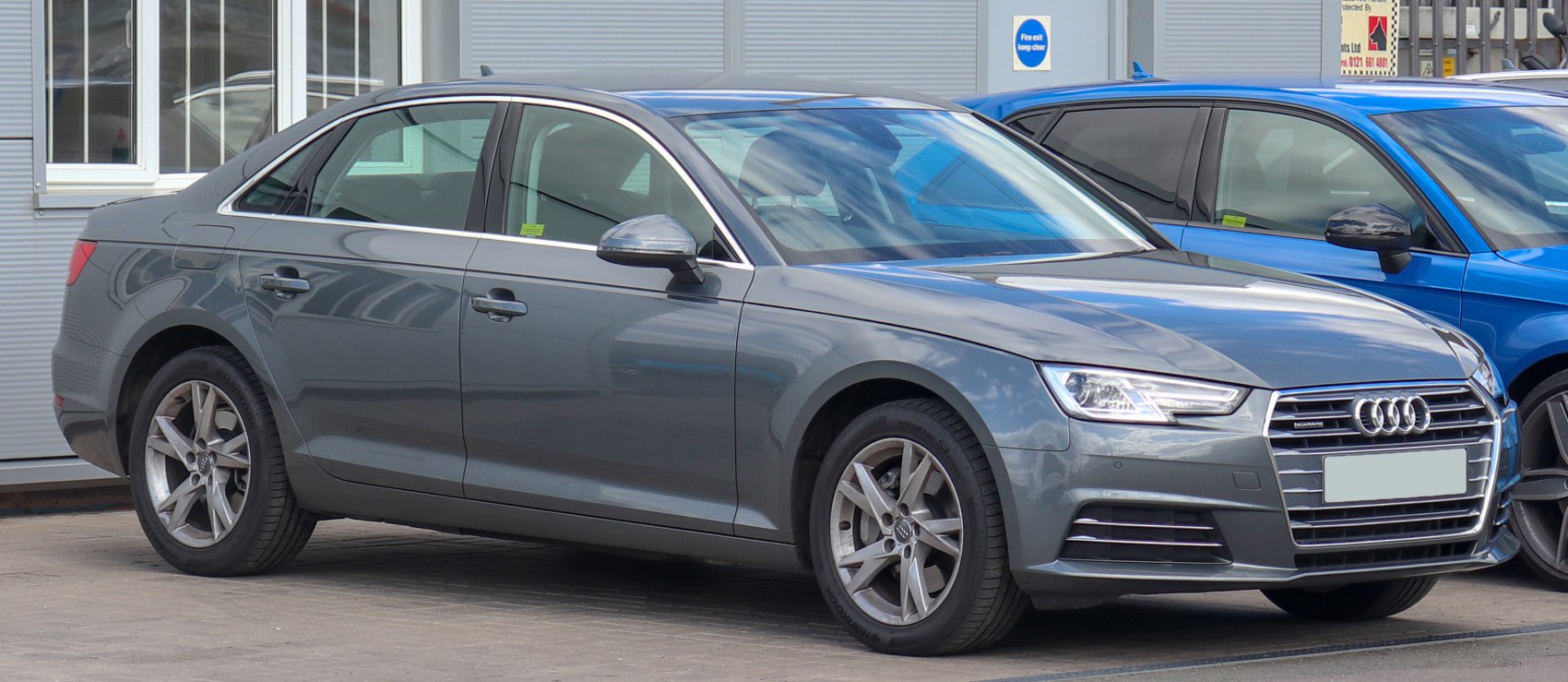 Sedan side profile and front with LED headlights and alloy wheels