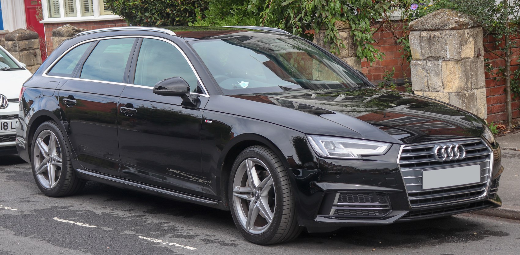 Black station wagon with LED headlights and alloy wheels