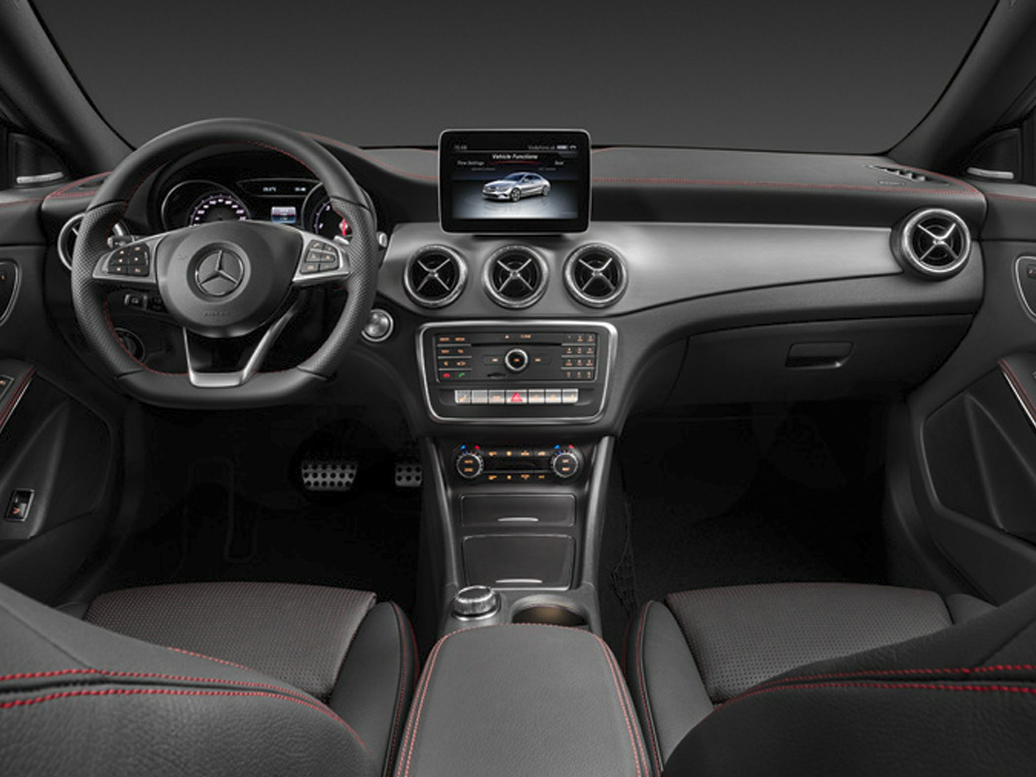 Interior dashboard and steering wheel with digital display and air vents