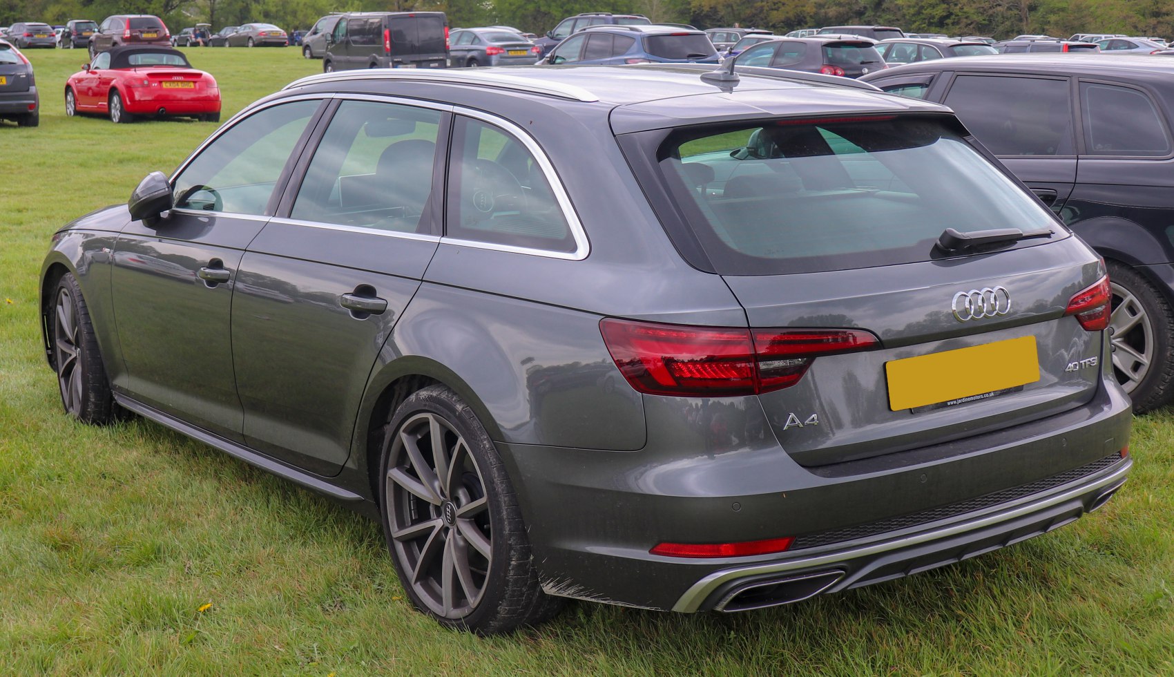 Rear and side view of a wagon with dual exhaust and alloy wheels