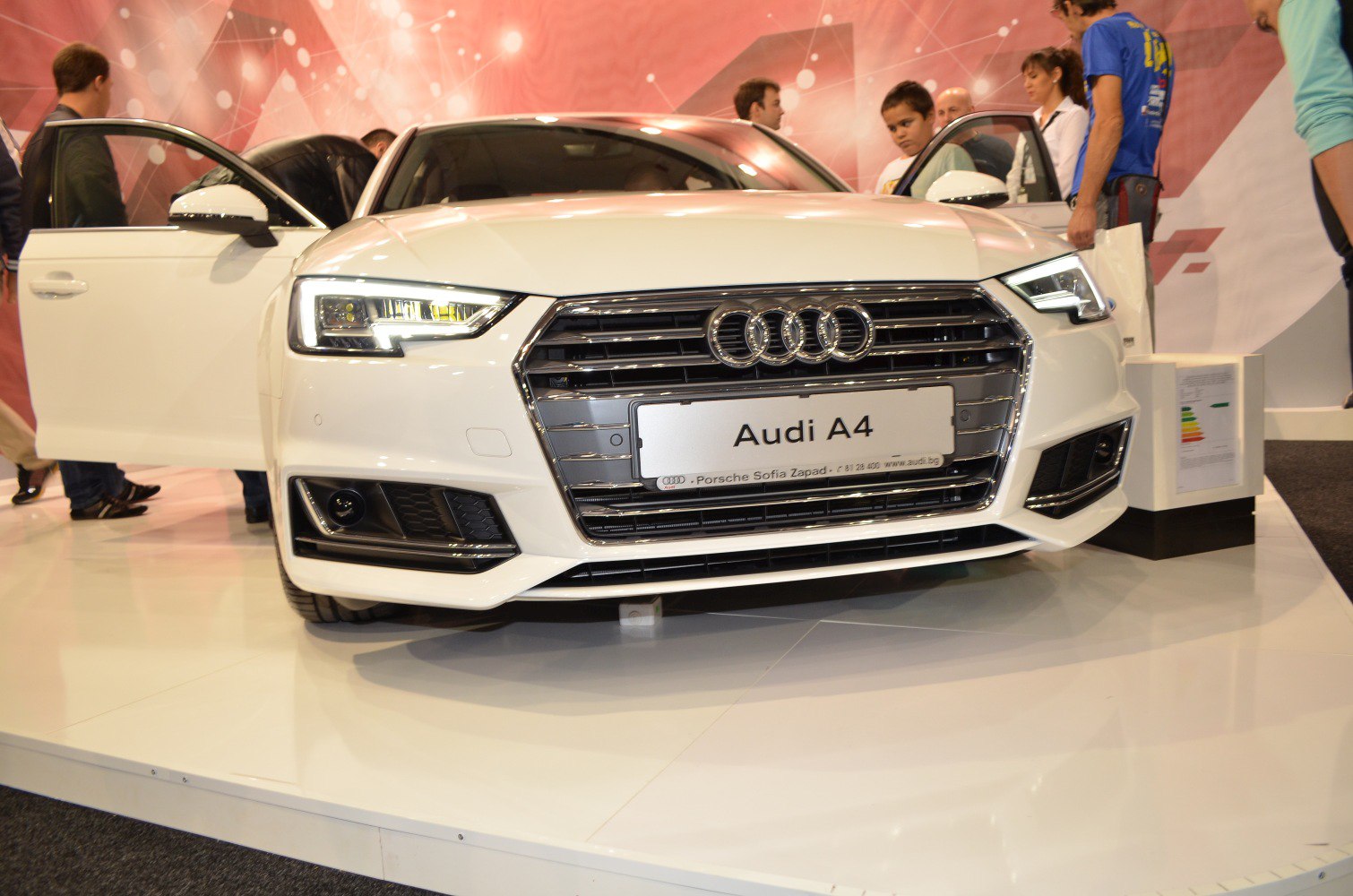 Close-up of car front with LED headlights and distinctive grille