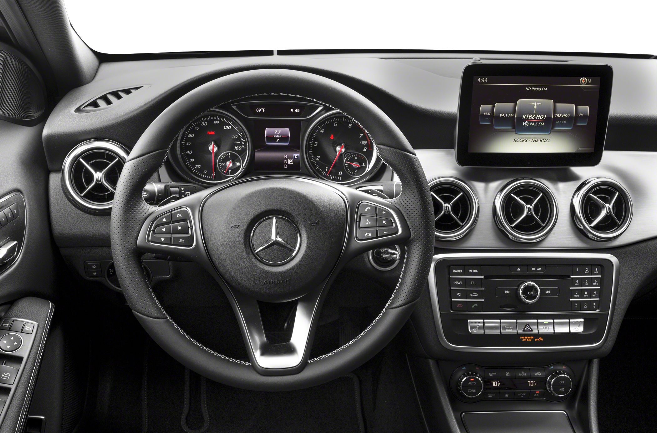 Steering wheel, digital cluster, infotainment display, and air vents