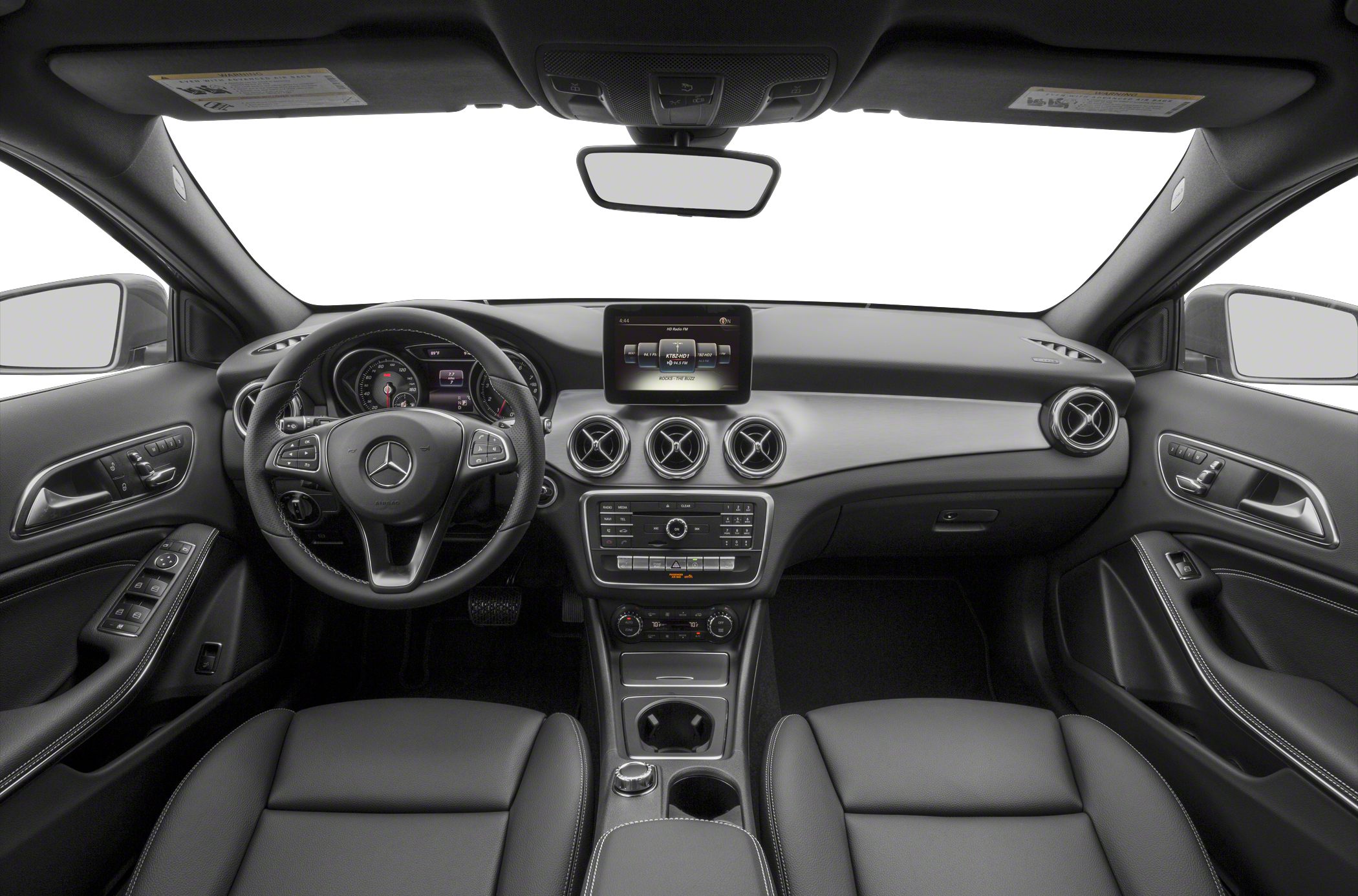 Dashboard and steering wheel with infotainment controls and circular air vents