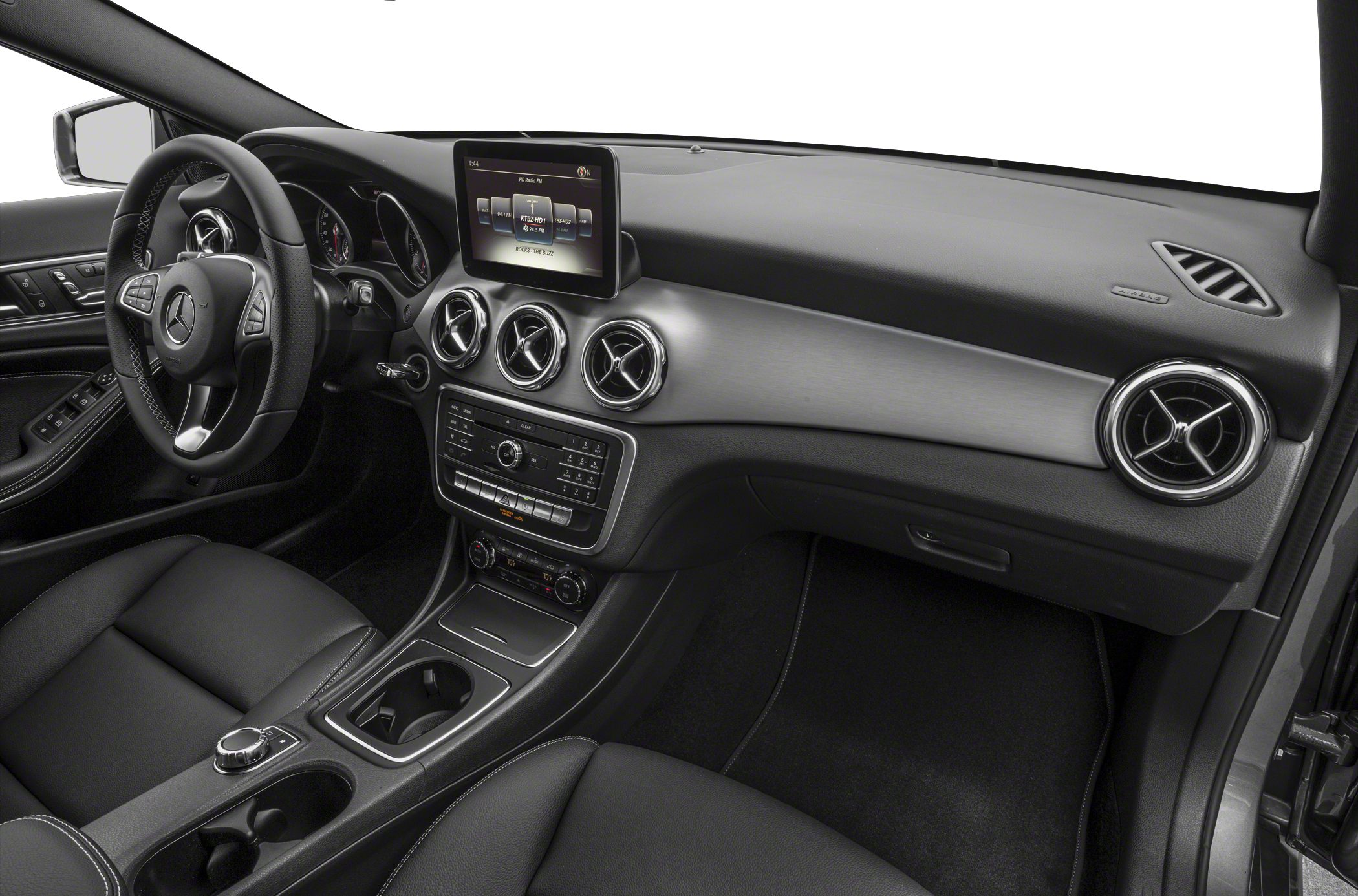 Dashboard with infotainment screen and circular air vents