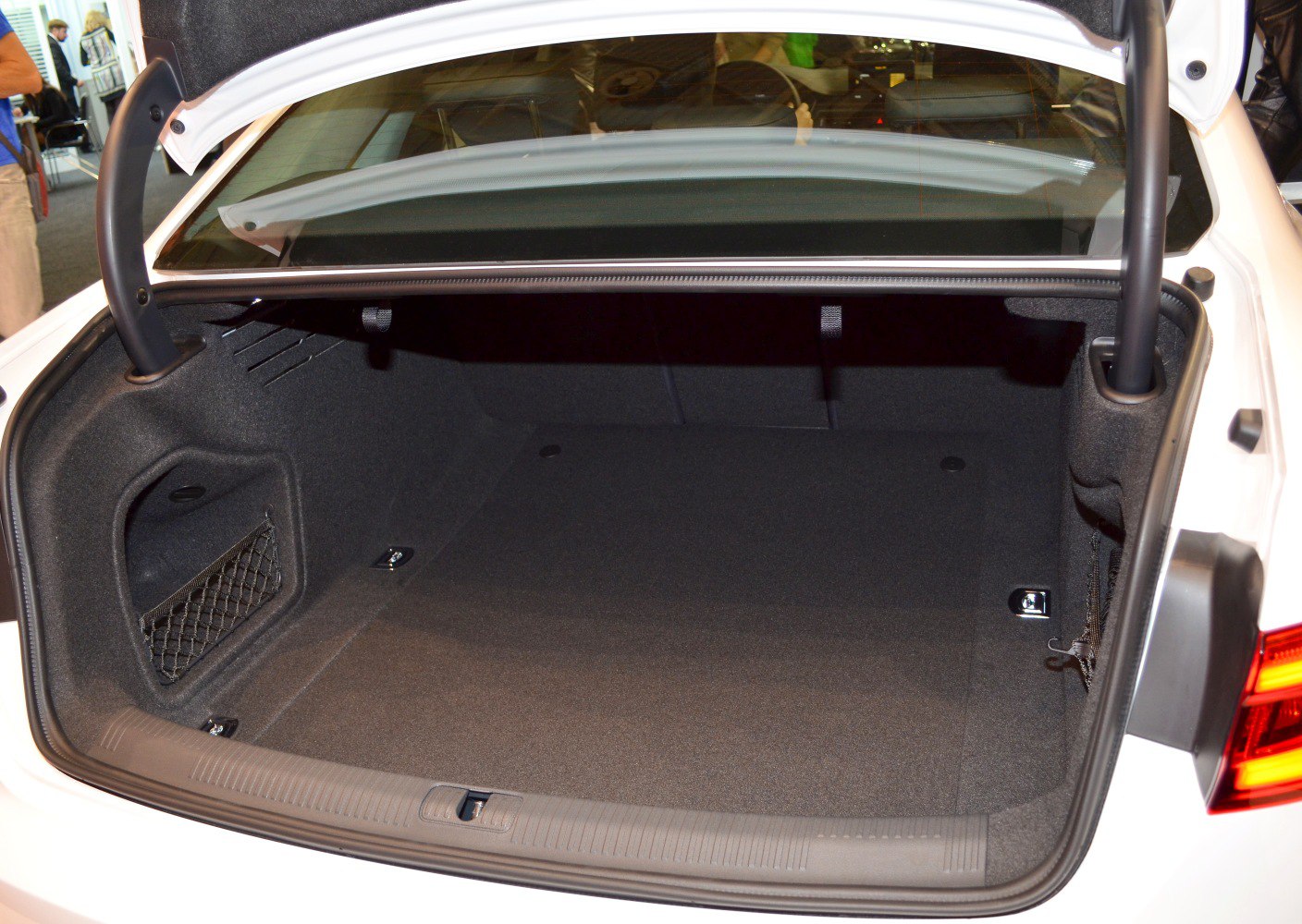 Spacious and clean sedan trunk interior with storage nets
