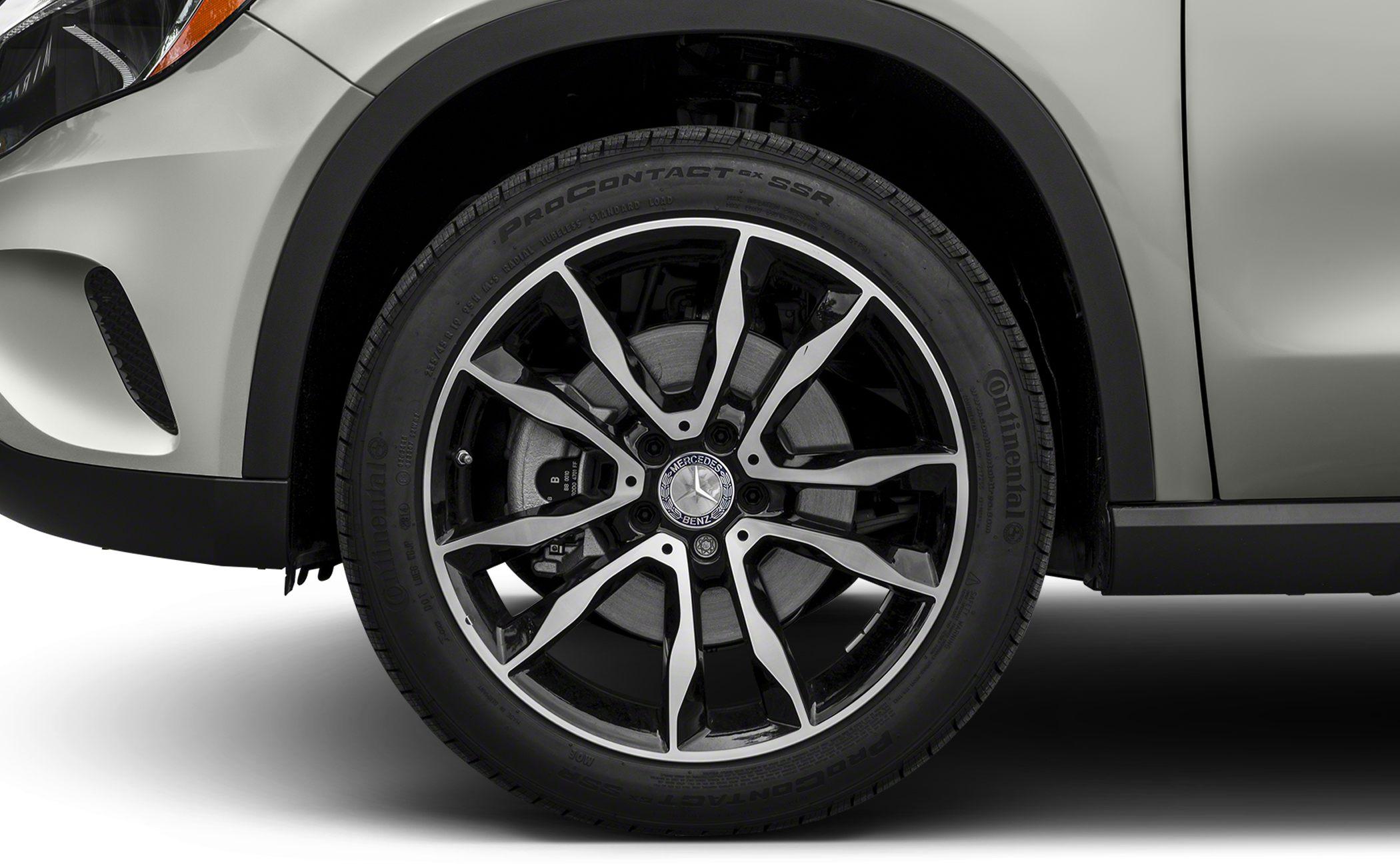 Close-up of multi-spoke alloy wheel with Continental tire and visible brake disc