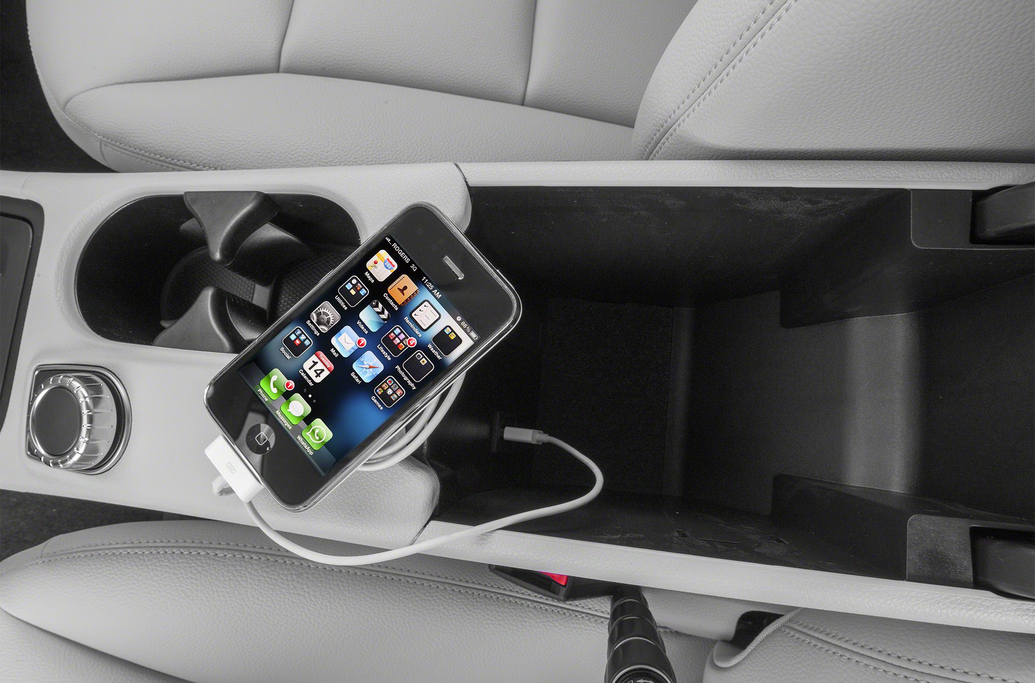 Center console storage compartment with USB phone charging cable
