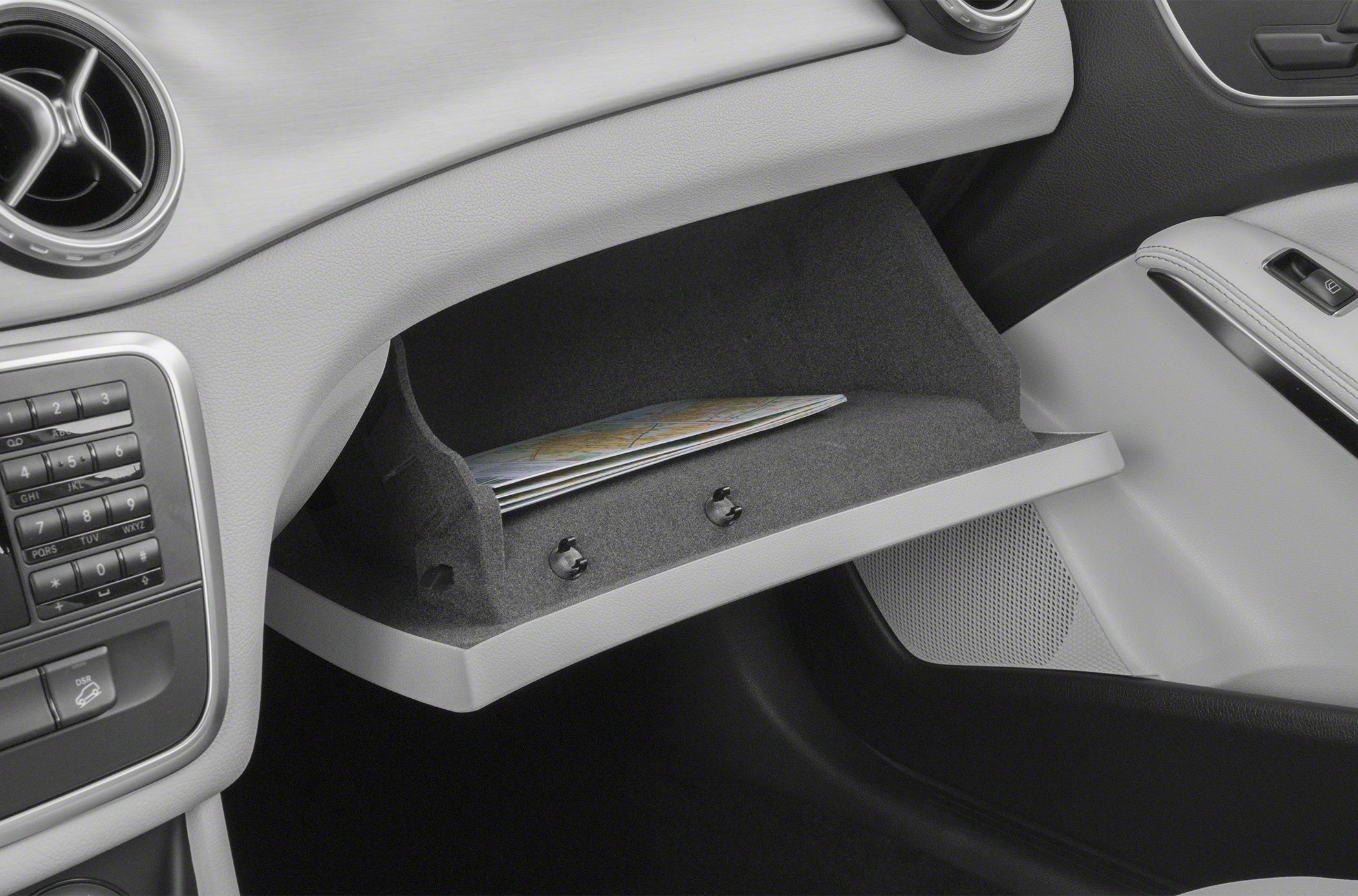 Open glove compartment with documents inside