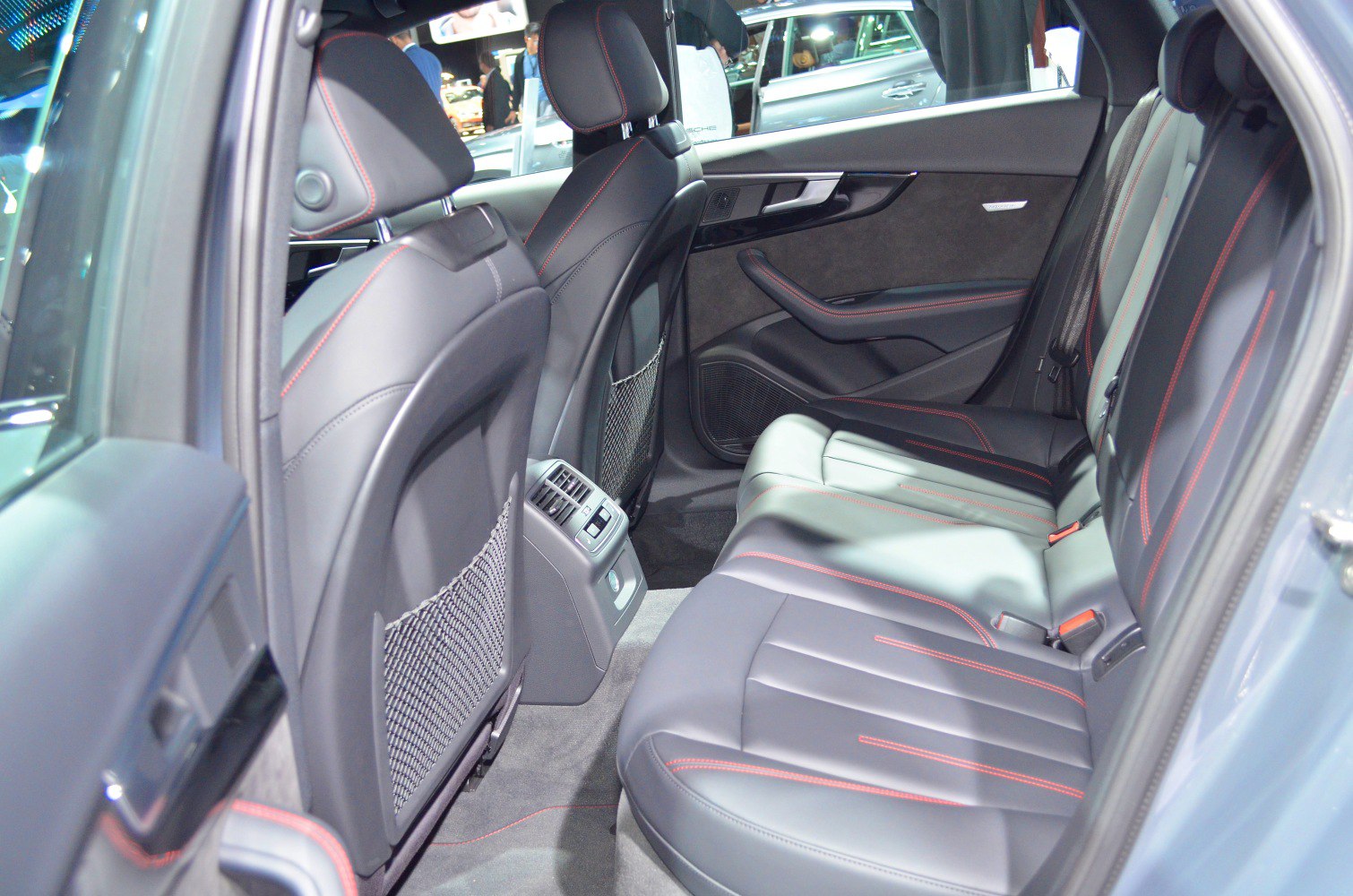 Black leather rear seats with red stitching and rear air vents