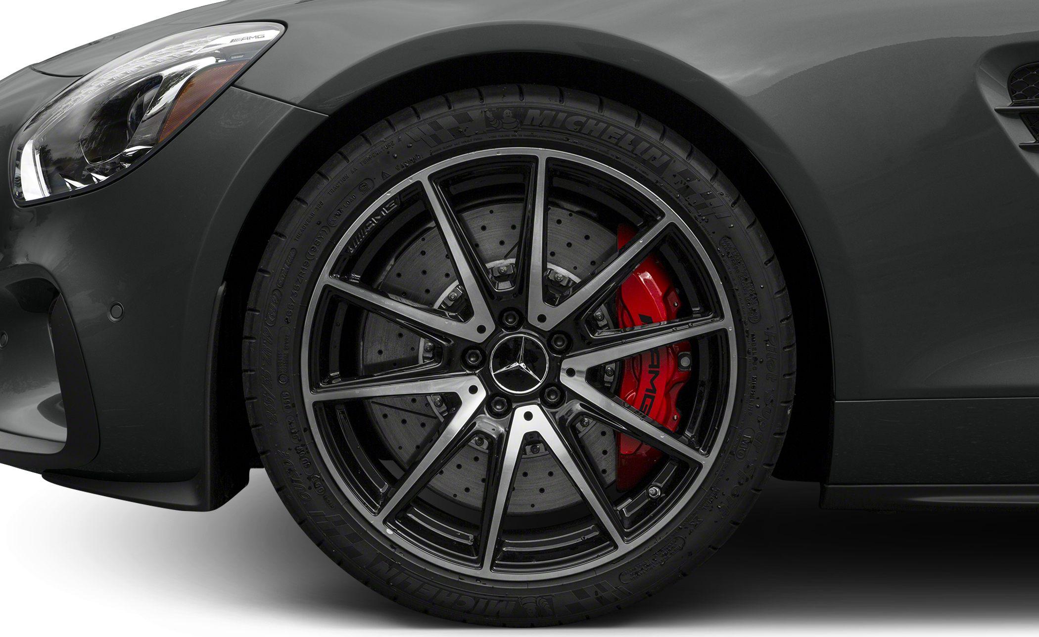 Front wheel with black multi-spoke rim and red brake caliper