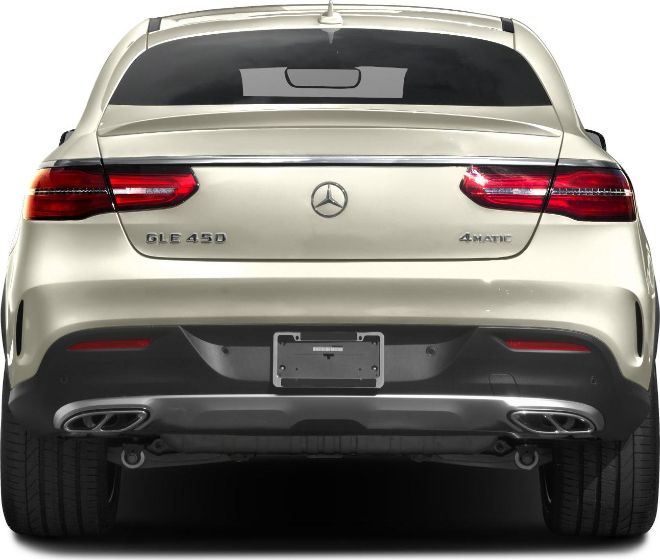 Rear view with taillights, dual exhaust, model badges, and chrome trim